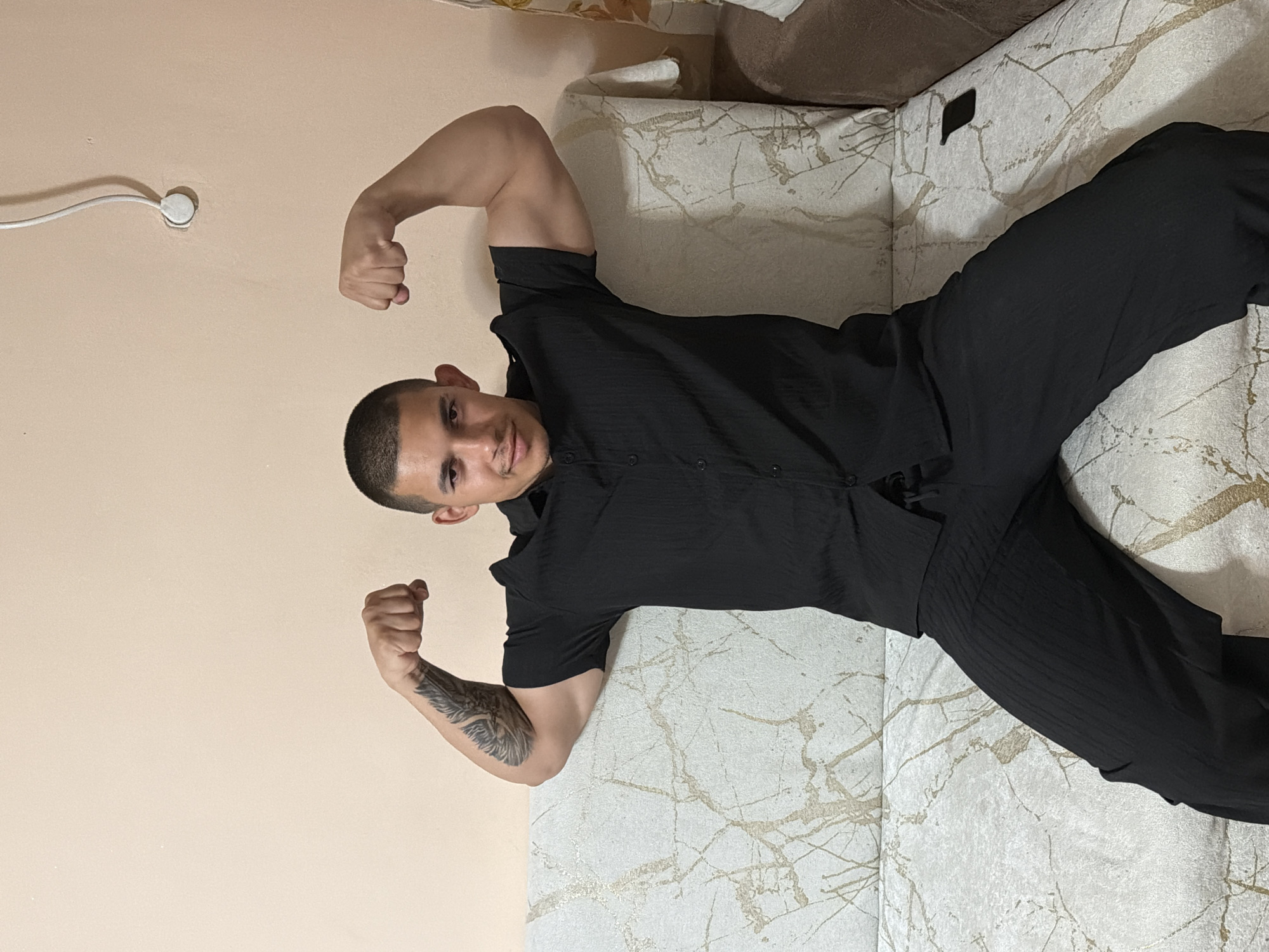 Man poses, flexes in bedroom while drinking energy drinks