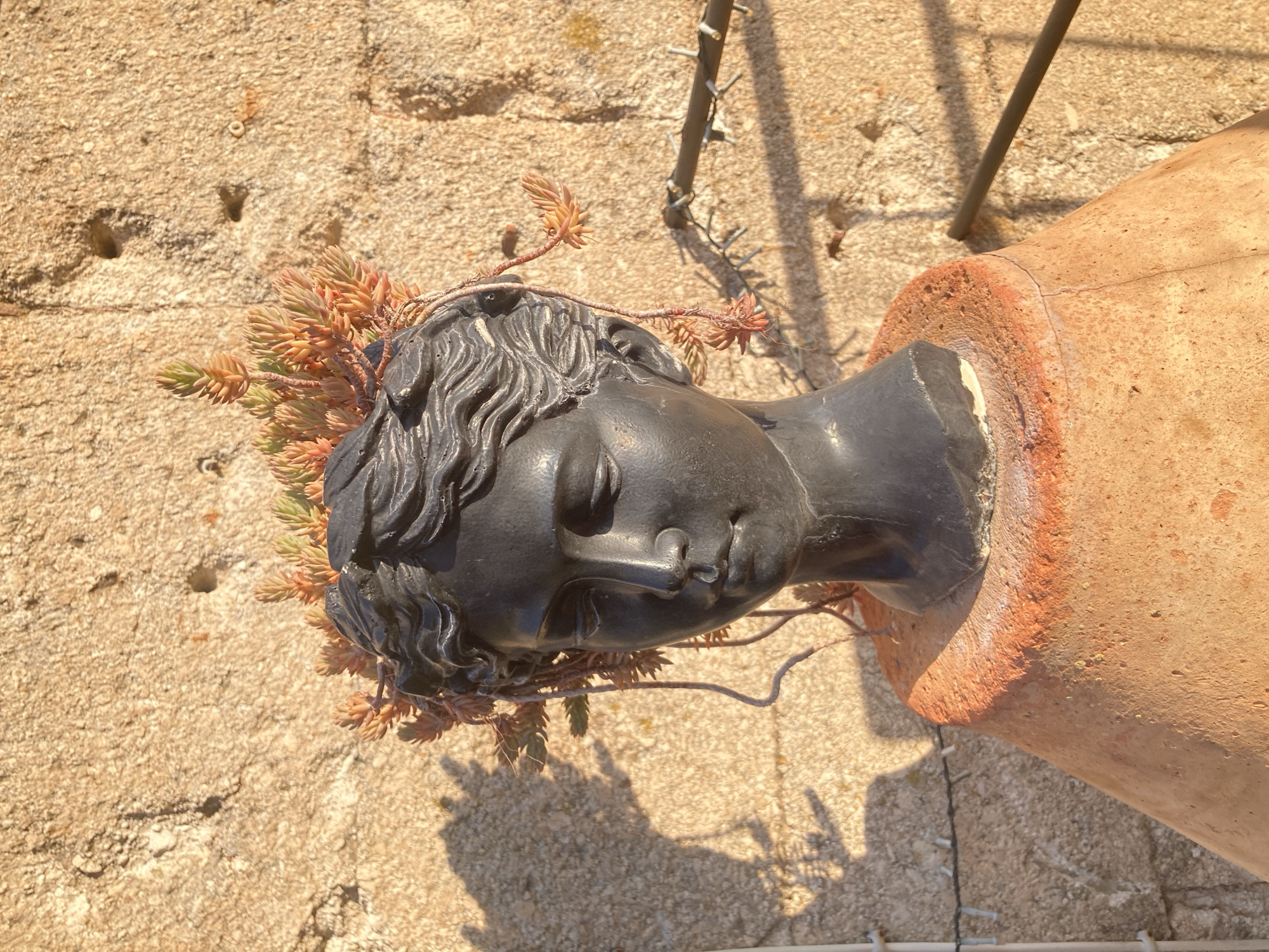 Avanos street details: stone archways, old walls, and planter art