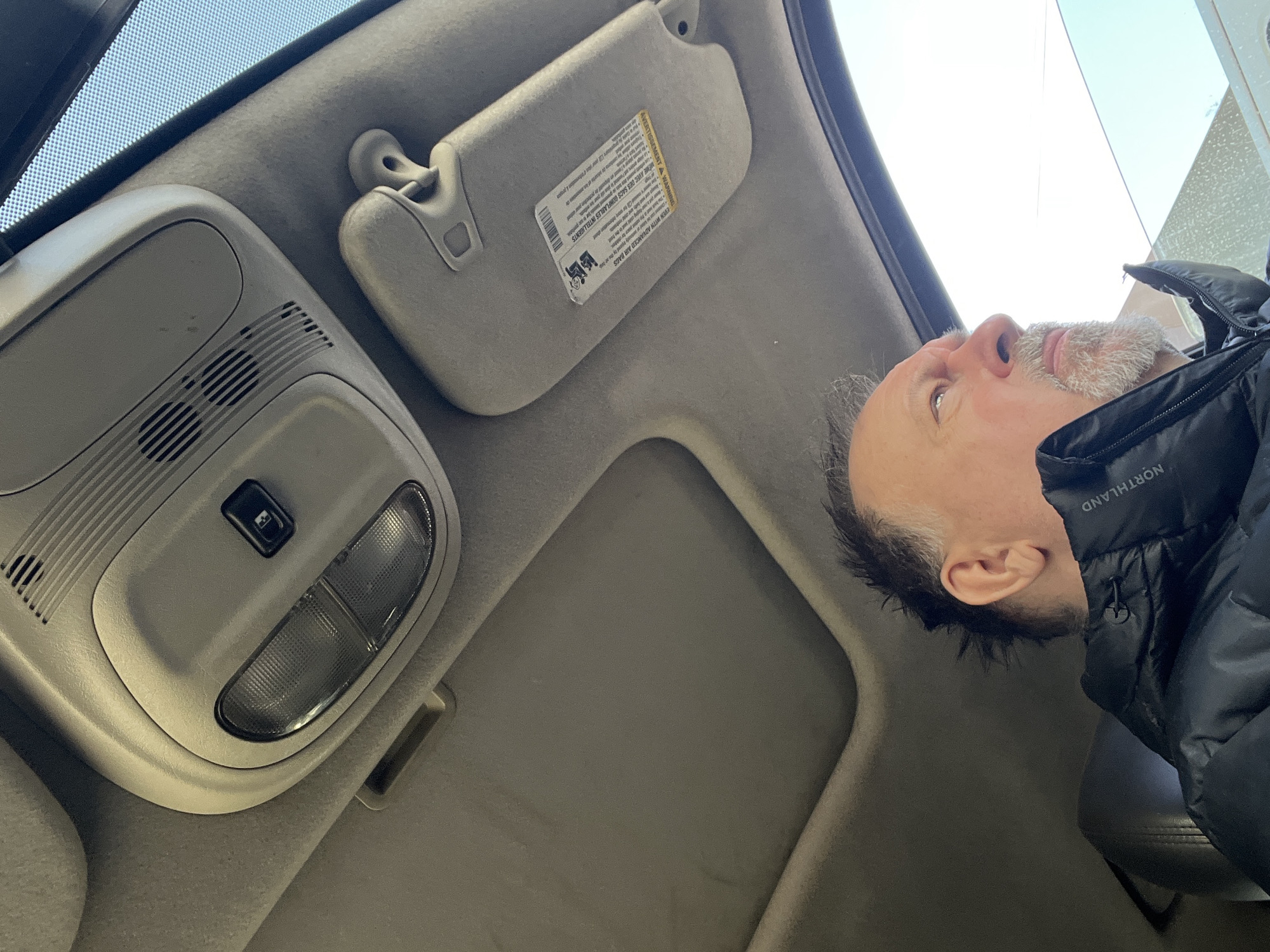 Man takes multiple selfies in car interior in Podolsk