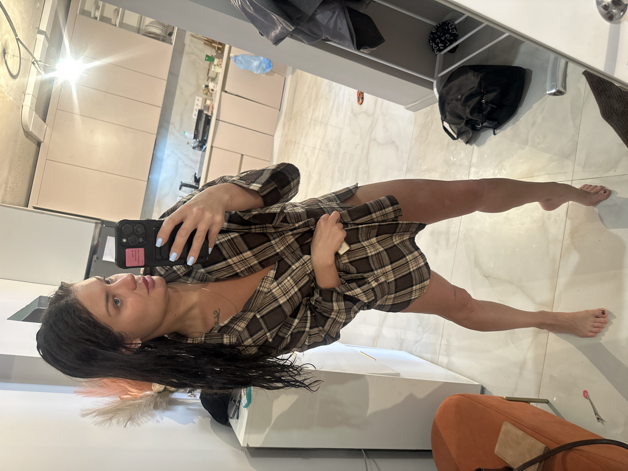 Woman takes selfie in indoor setting in Khimki