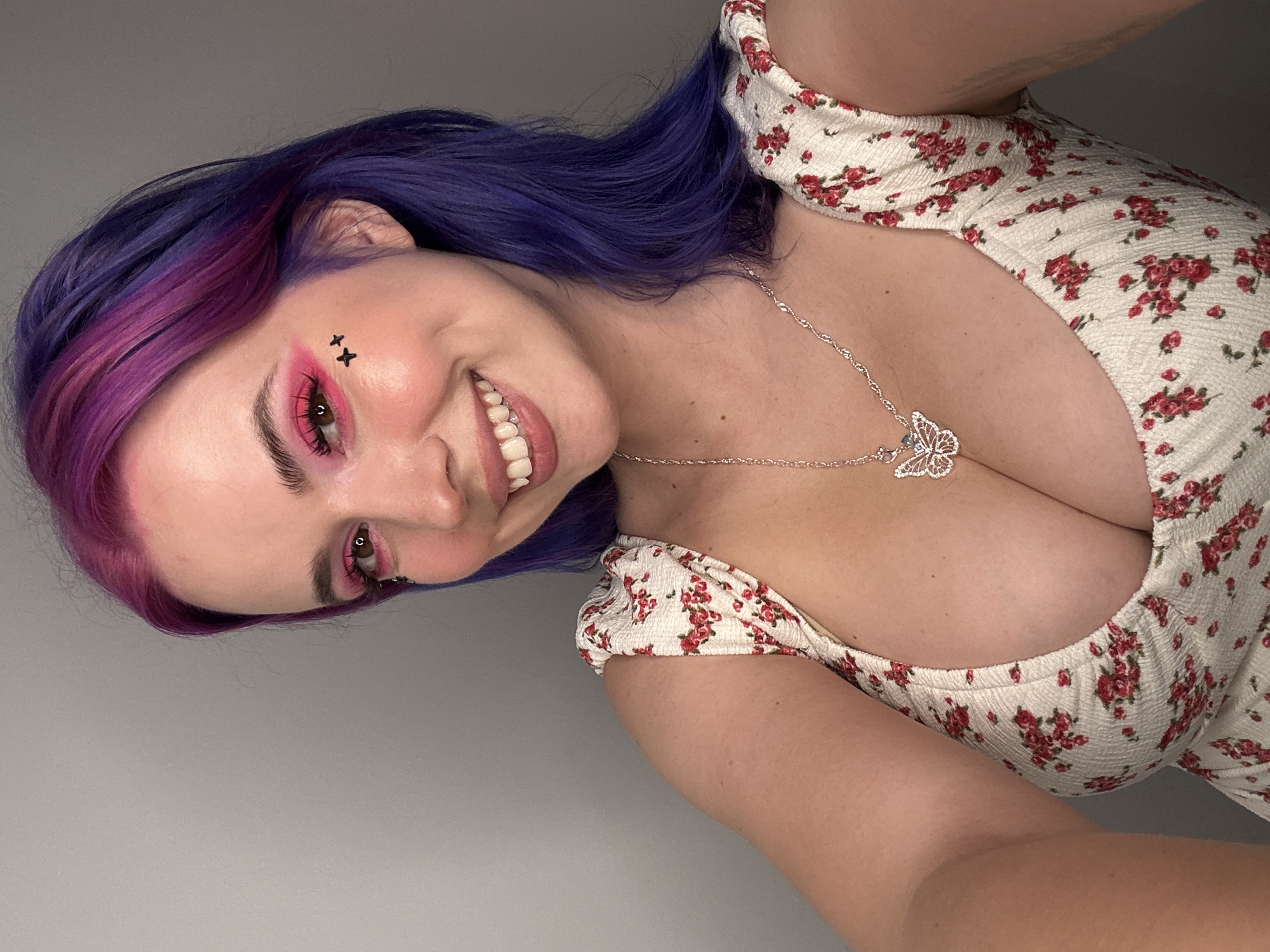 Woman takes colorful selfies with anime plushie in Ljubljana