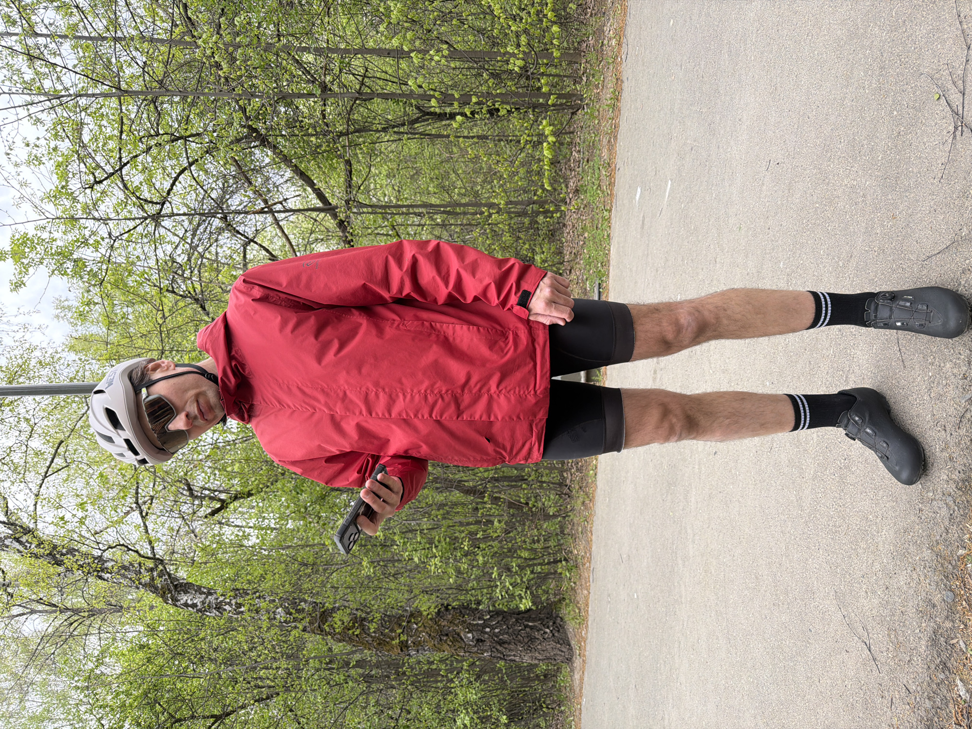 Cyclist group stops on wooded path in Tyumen