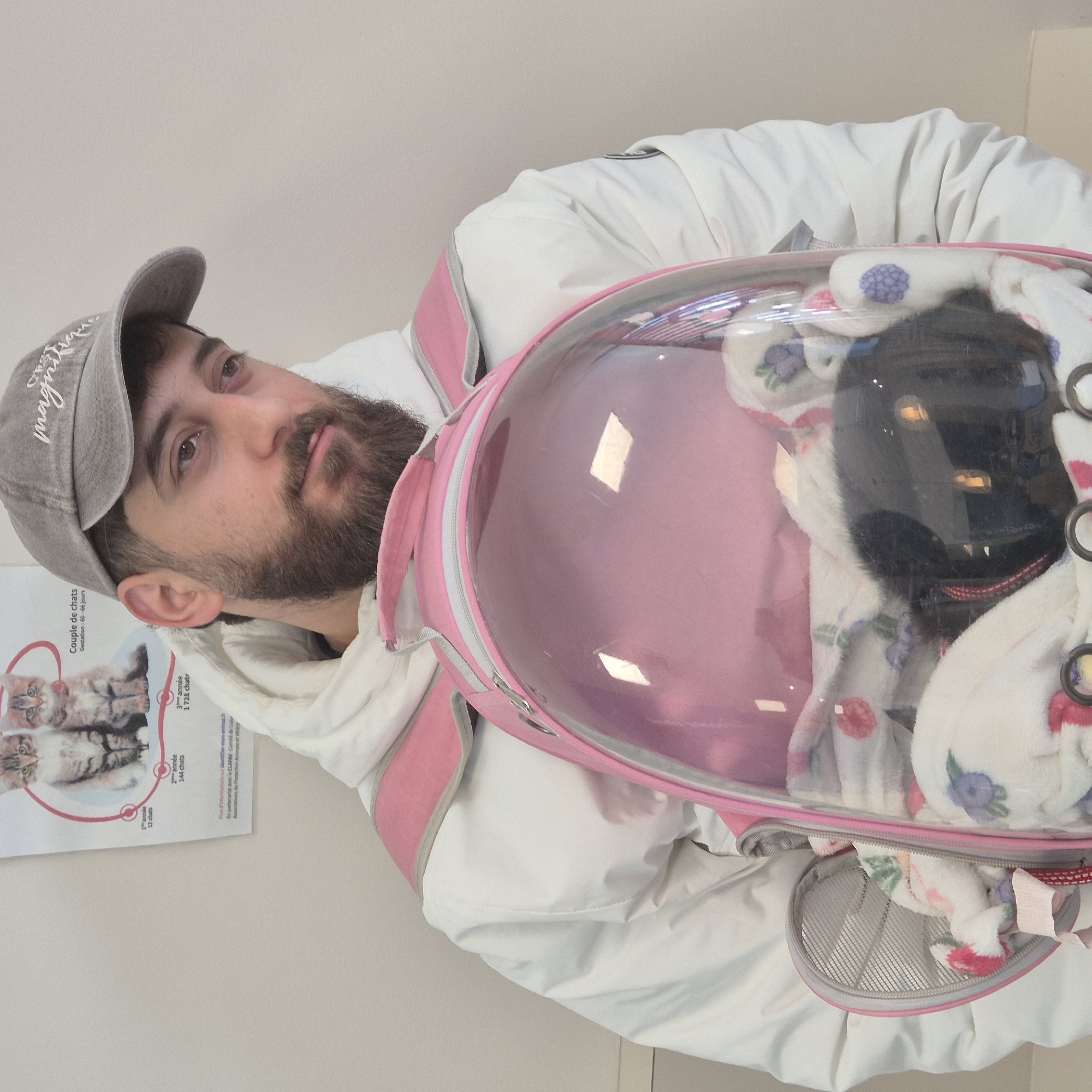 Man brings cat in bubble backpack to vet clinic
