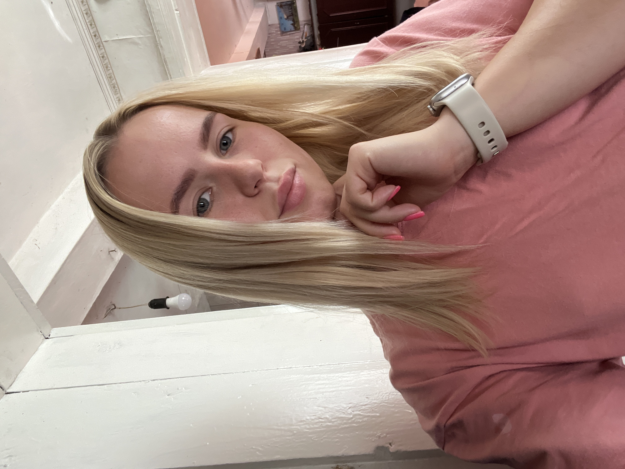 Quick selfie series in an indoor tiled setting, pink shirt throughout