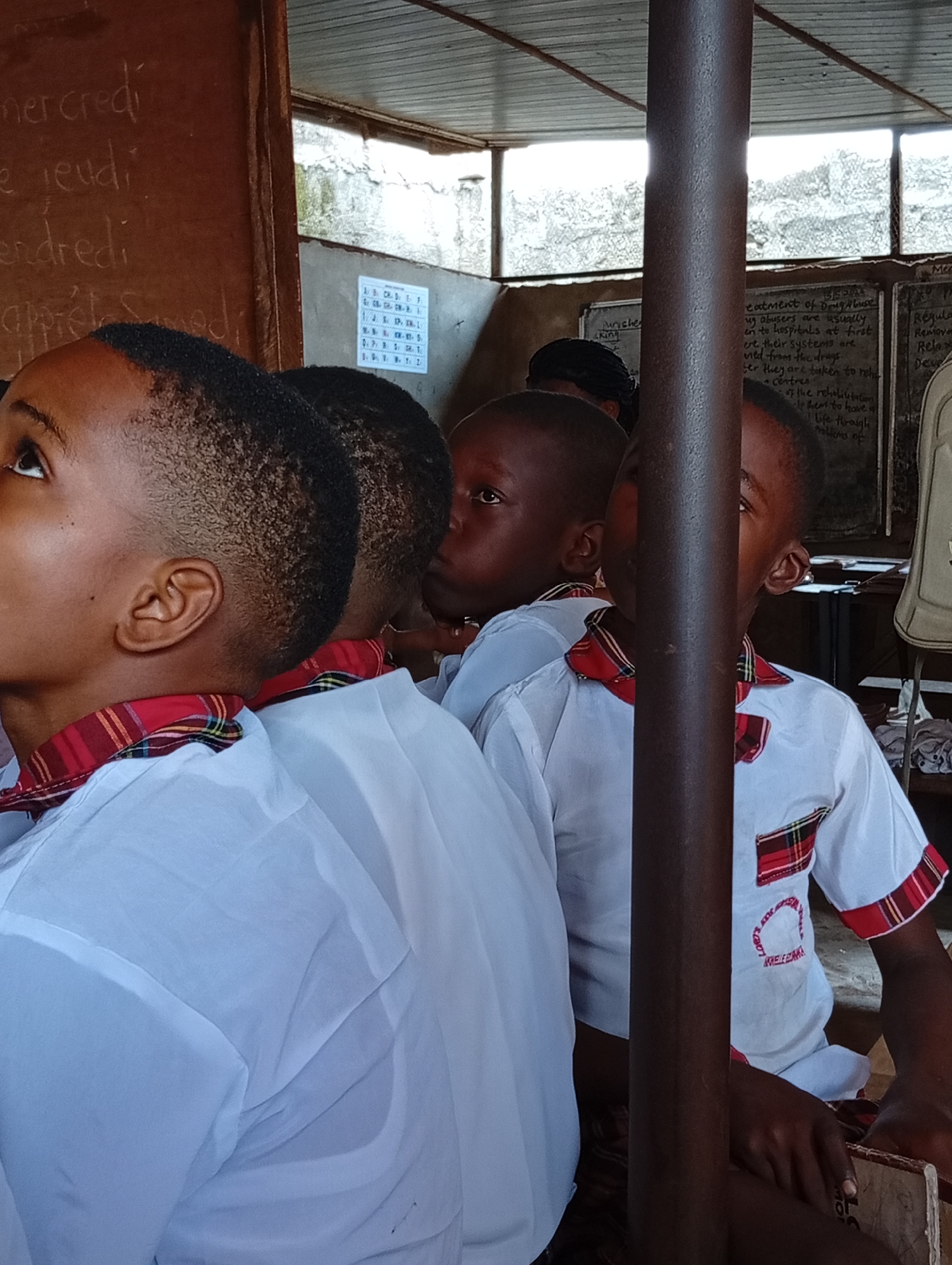 School day documented: uniformed students attend classroom lessons