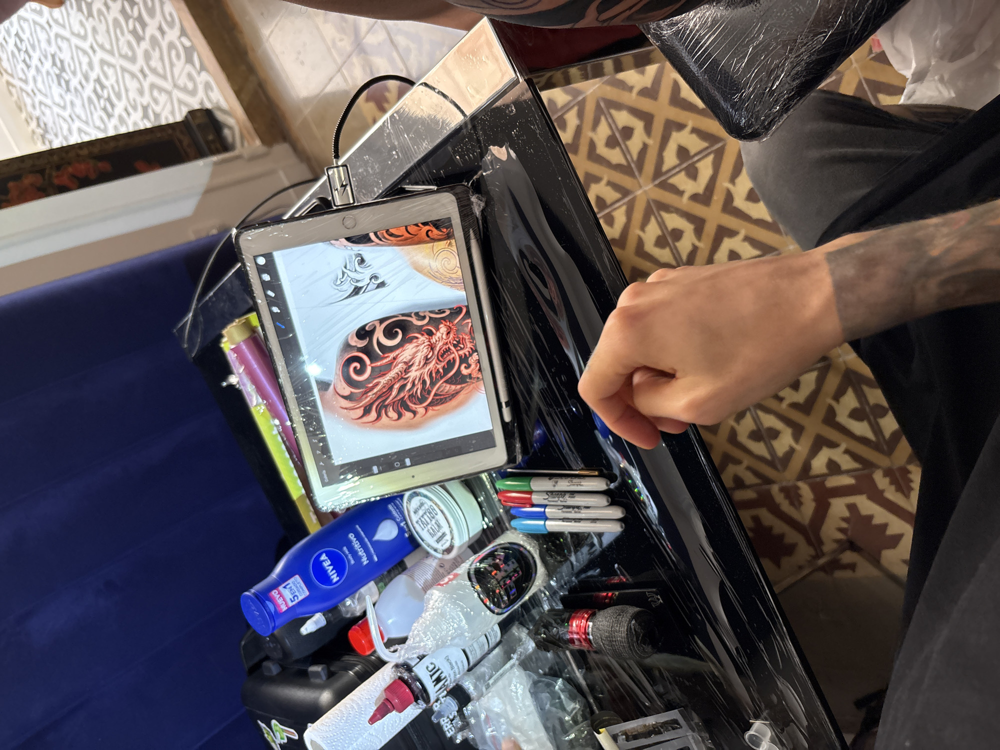 Dragon tattoo session documented in Barcelona tattoo studio