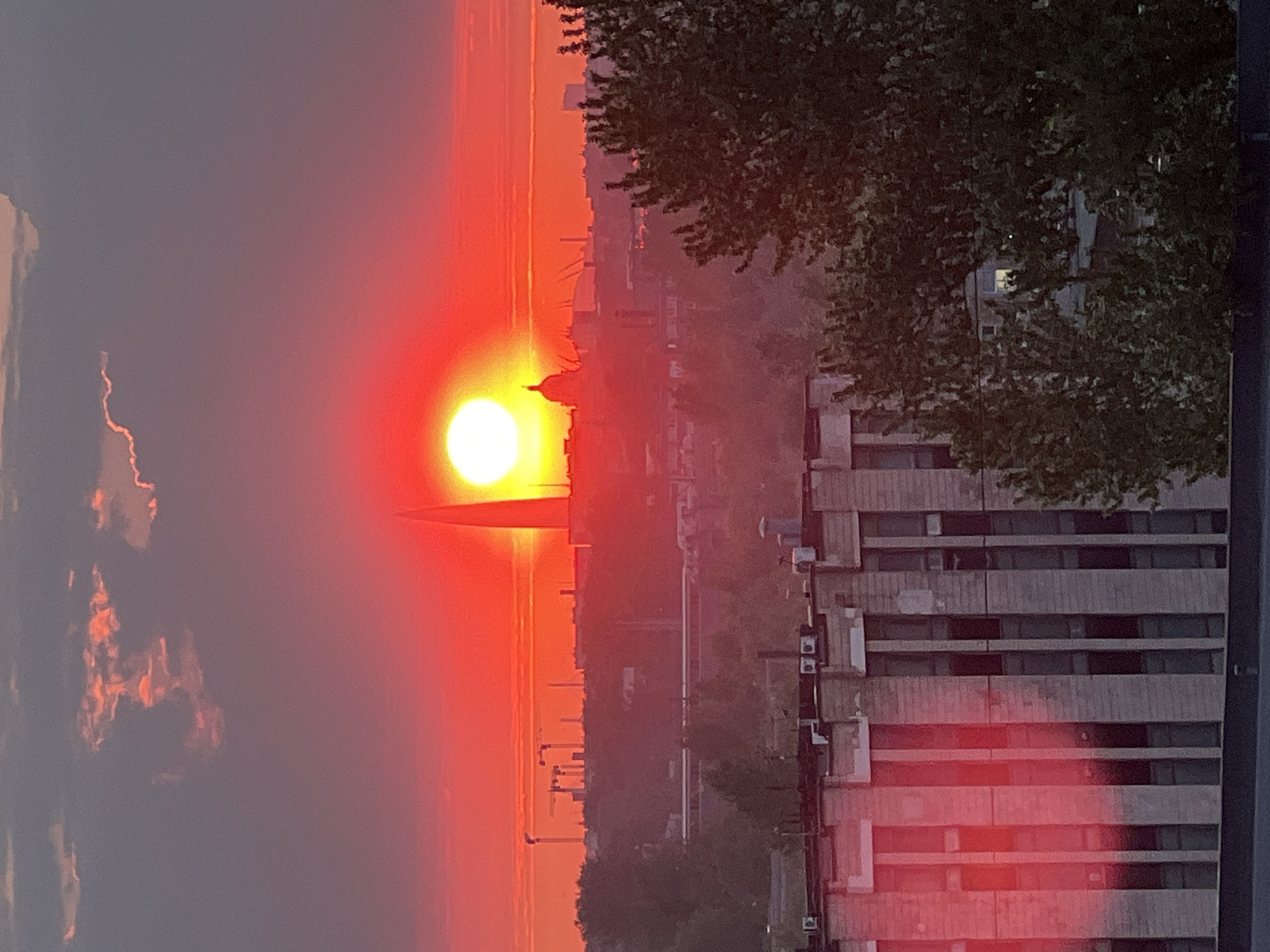 Vibrant red sunset observed over Saint Petersburg cityscape