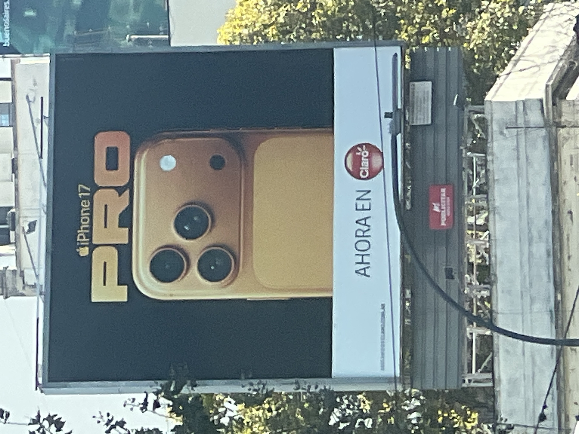 Buenos Aires street scenes: iPhone billboard, car maintenance, delivery driver