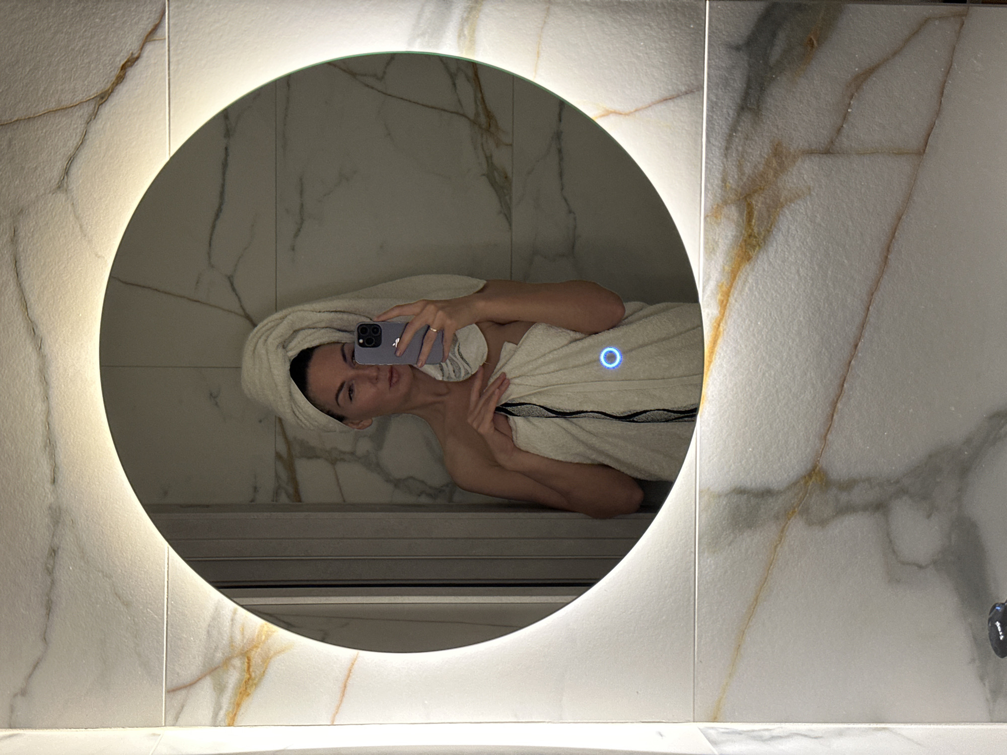 Woman takes post-shower selfie in Chaikovsky bathroom