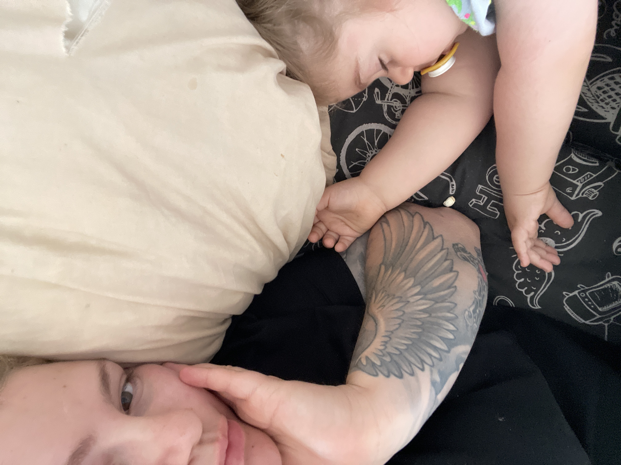 Mother and child rest together in Senden home