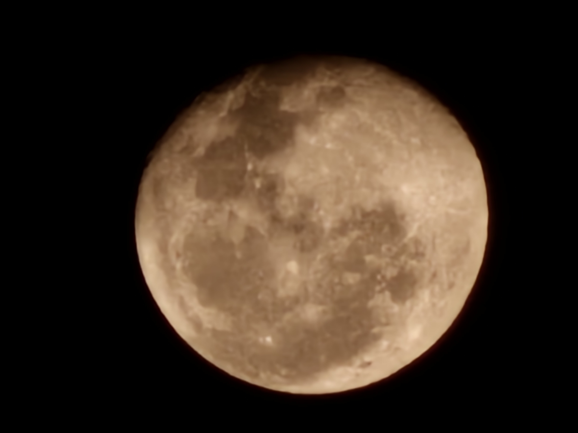 Full moon rises over Esch-sur-Alzette on a clear night