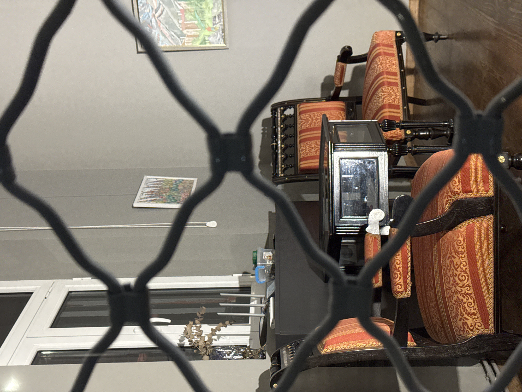Interior glimpse through barred window in Sofia Bulgaria