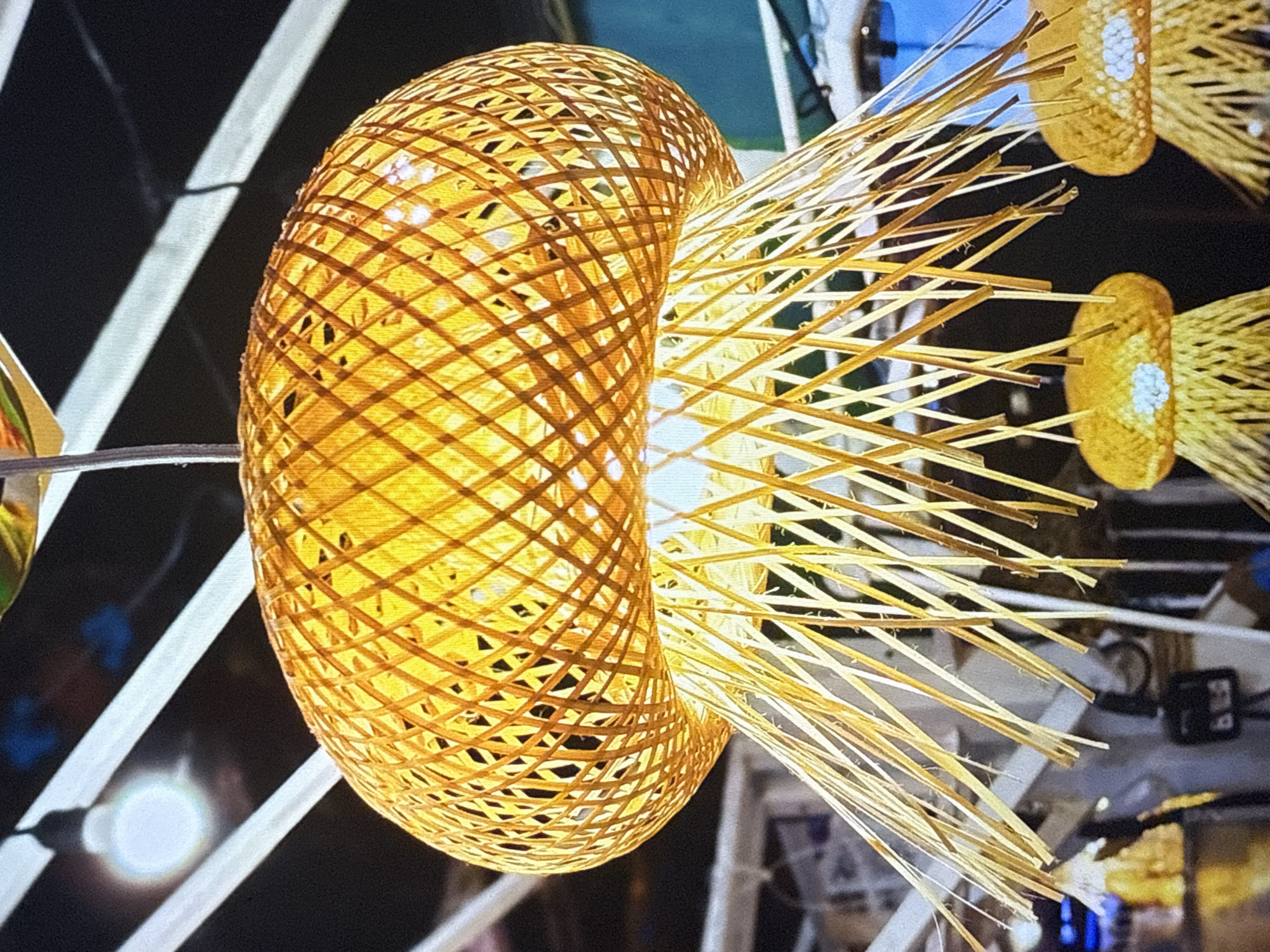 Lanterns, gongs, and a golden Buddha in a temple setting