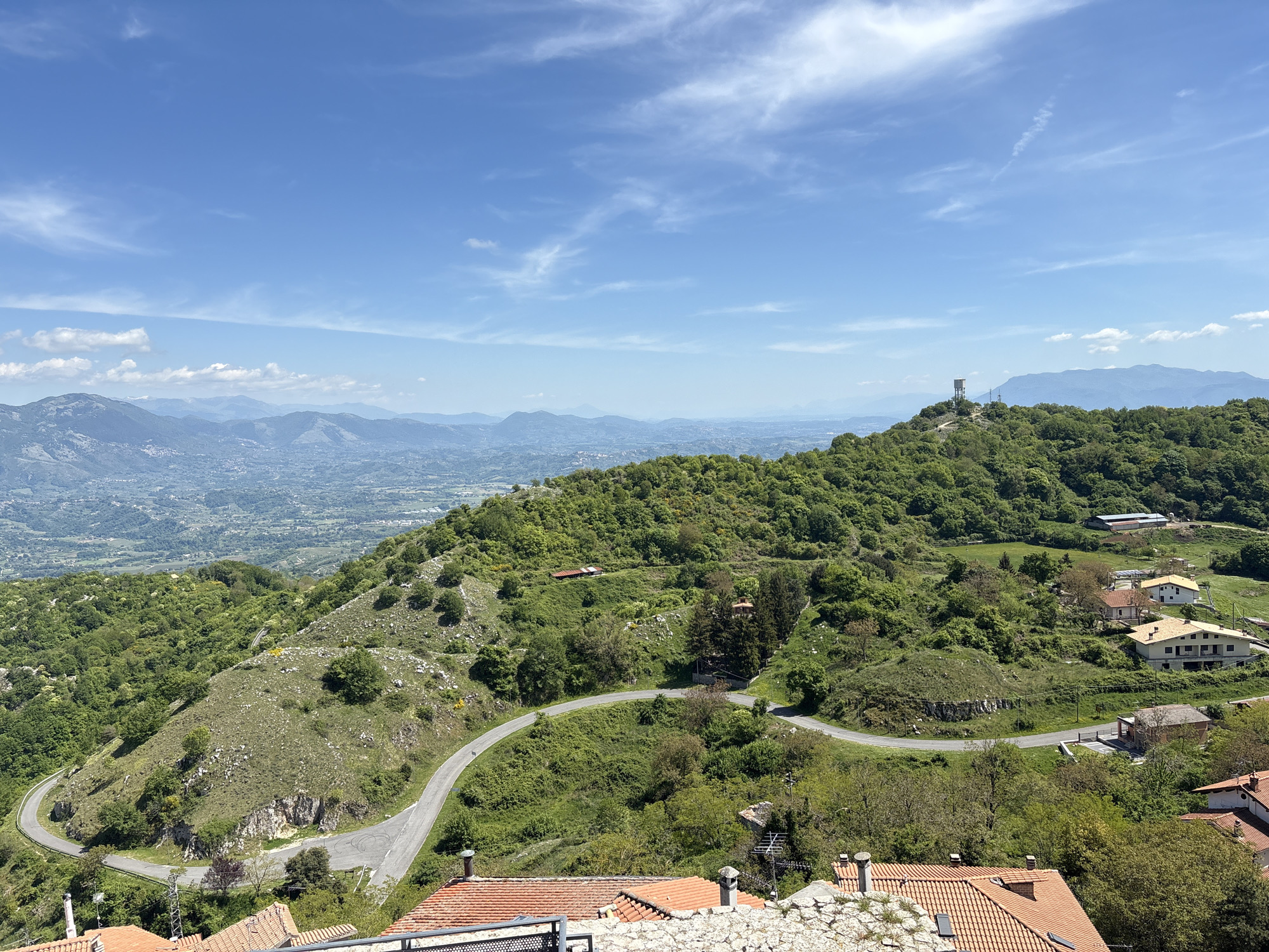 Tourist captures scenic views and dinosaur sculptures in Italian hilltown