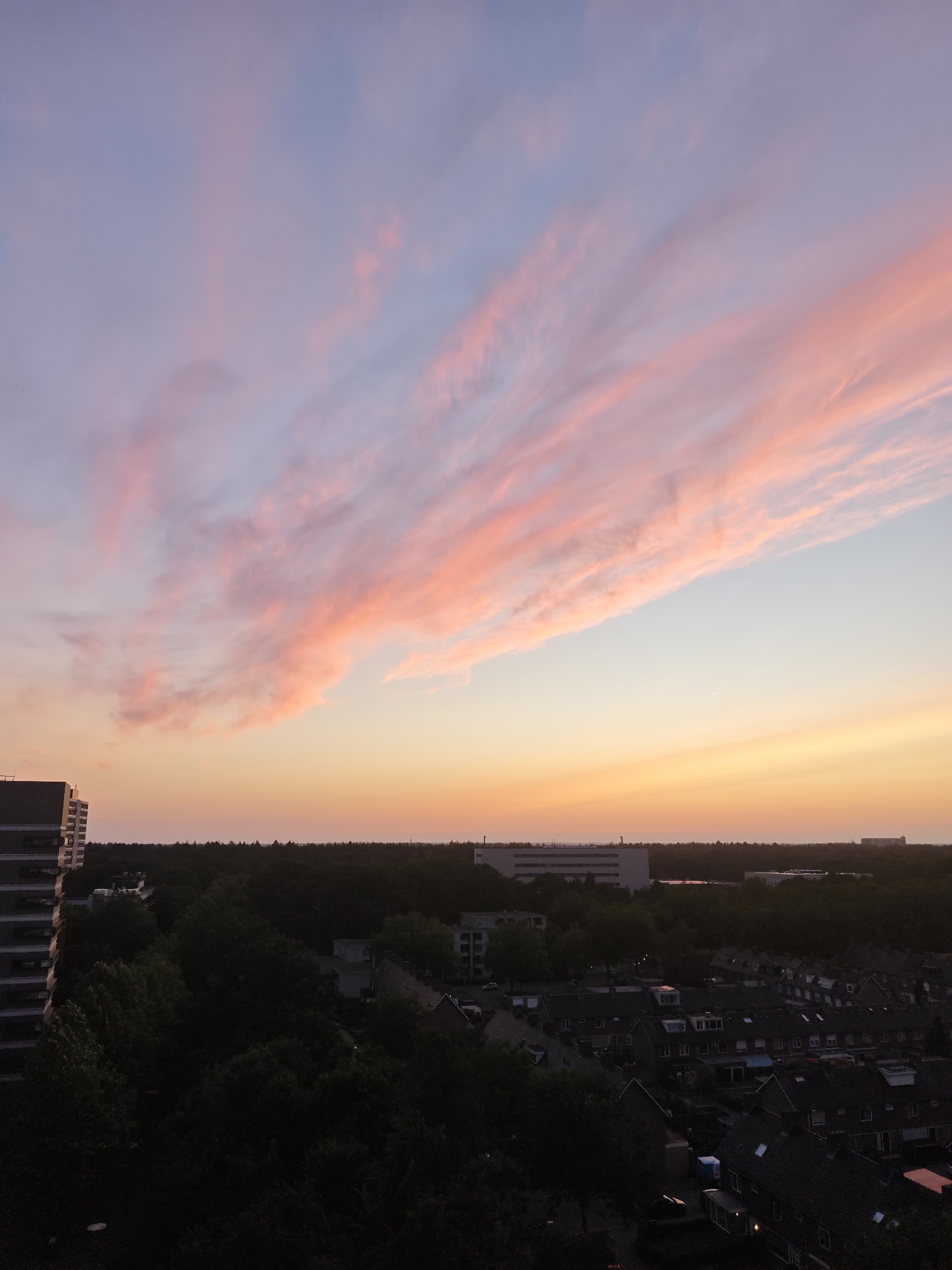 Tilburg sunset from the air, dusk gradients over the city