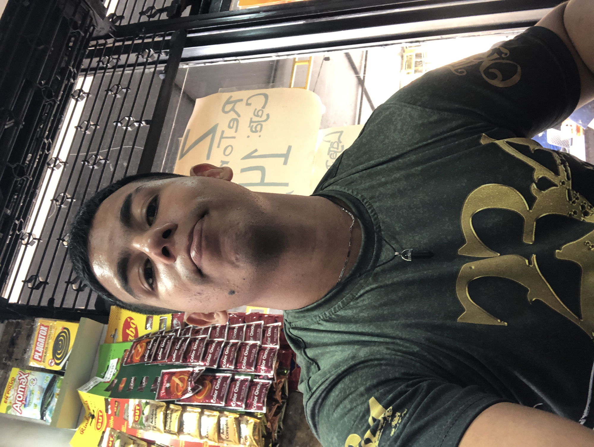 Man takes selfie in small Venezuelan store