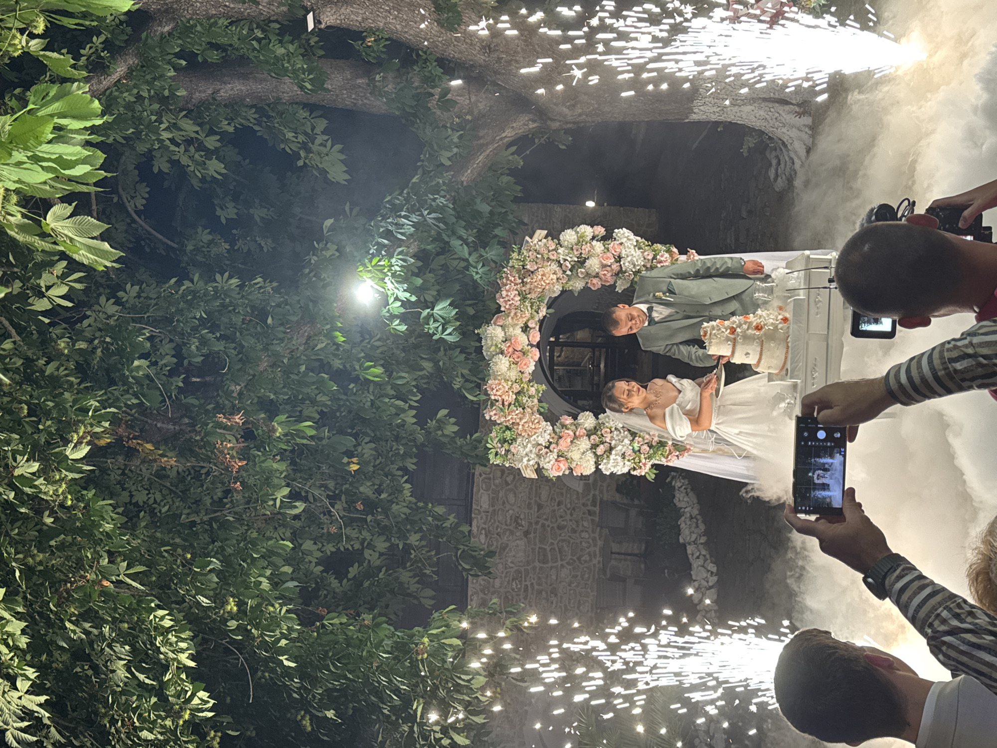 Wedding reception in Arbanassi with dancing, pyrotechnics, and folk tradition.