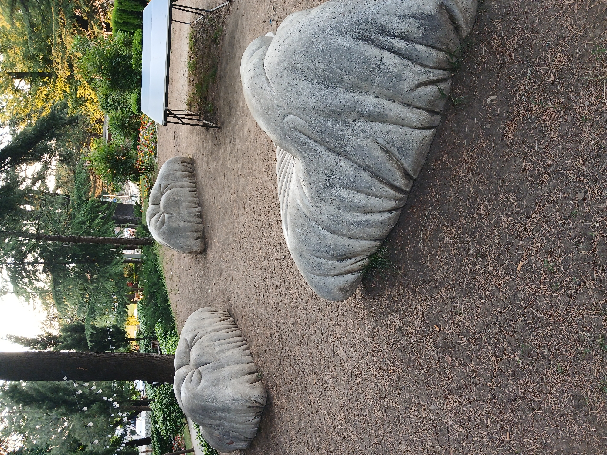 Afternoon in a blooming Telavi park with sculptures and roses