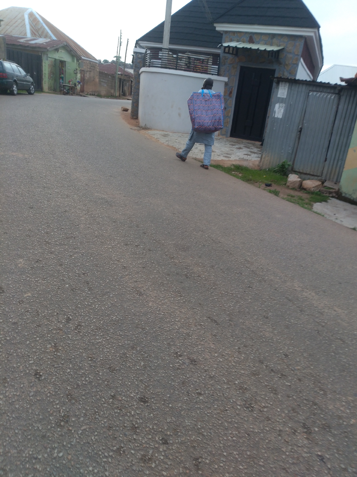 Daily life unfolds across Jos, Nigeria neighborhoods during evening hours