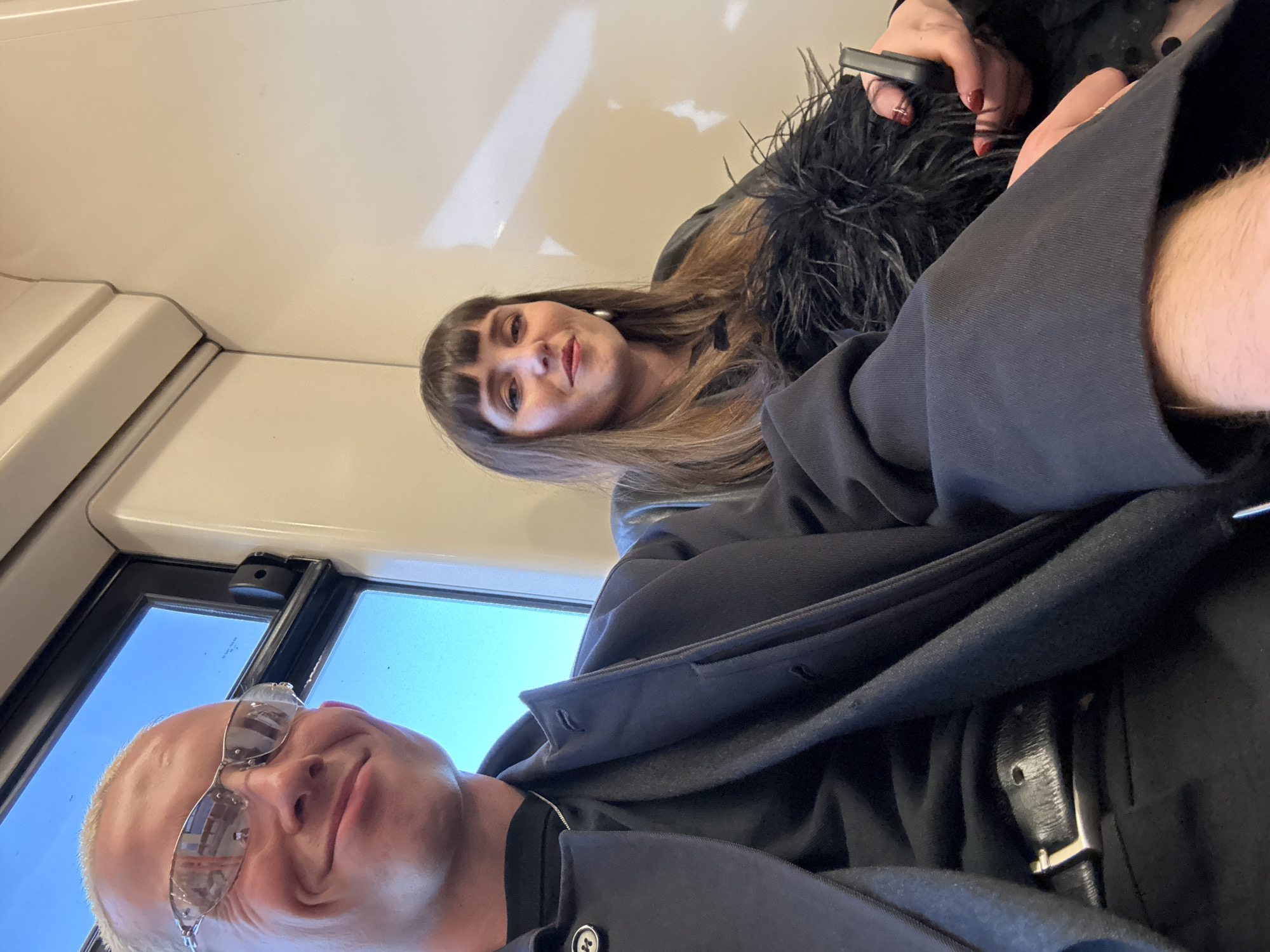 Passengers take selfie on sunny London train Friday evening
