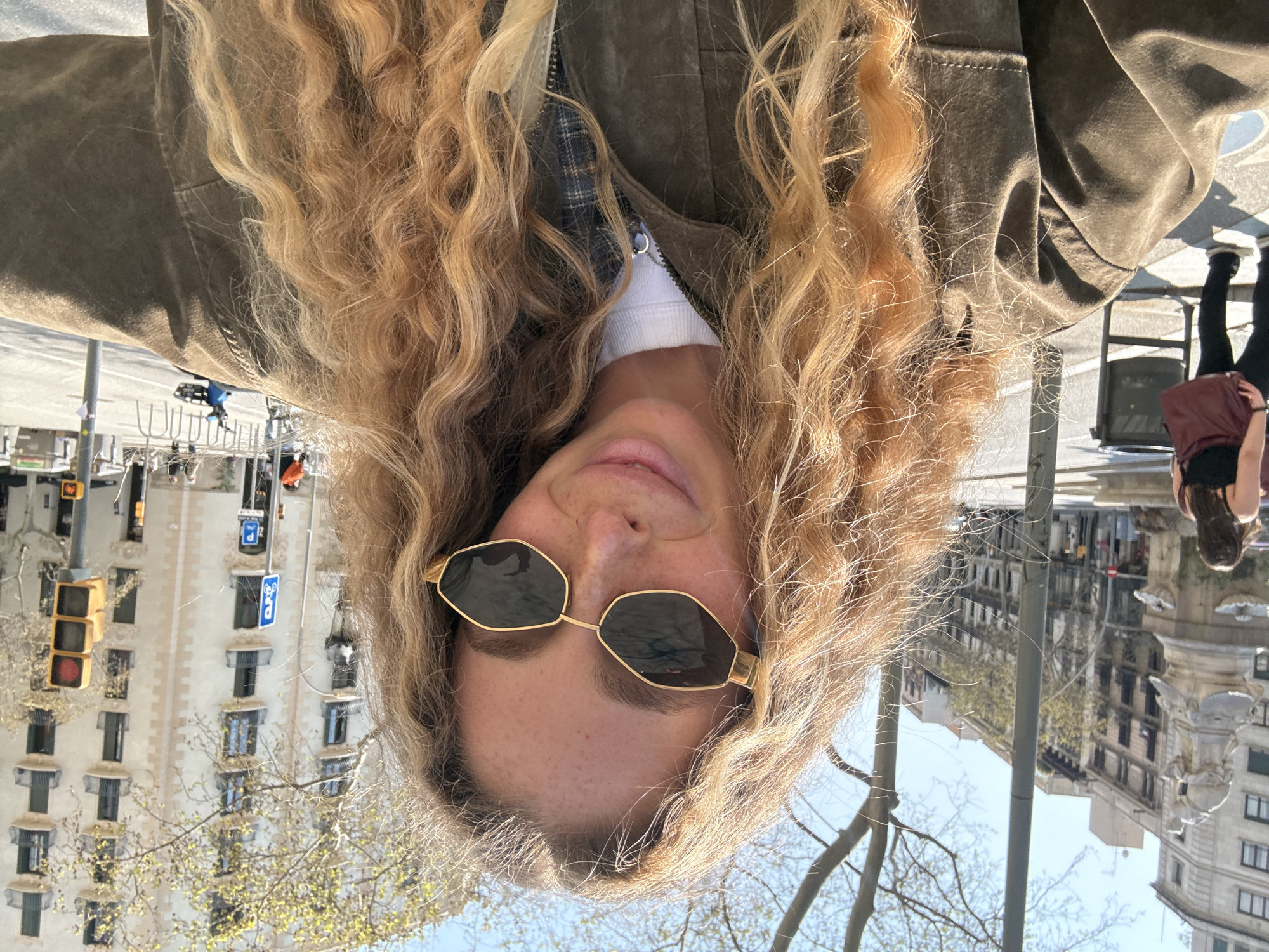 Tourist takes selfies near Hotel Majestic on Barcelona's Passeig de Gràcia