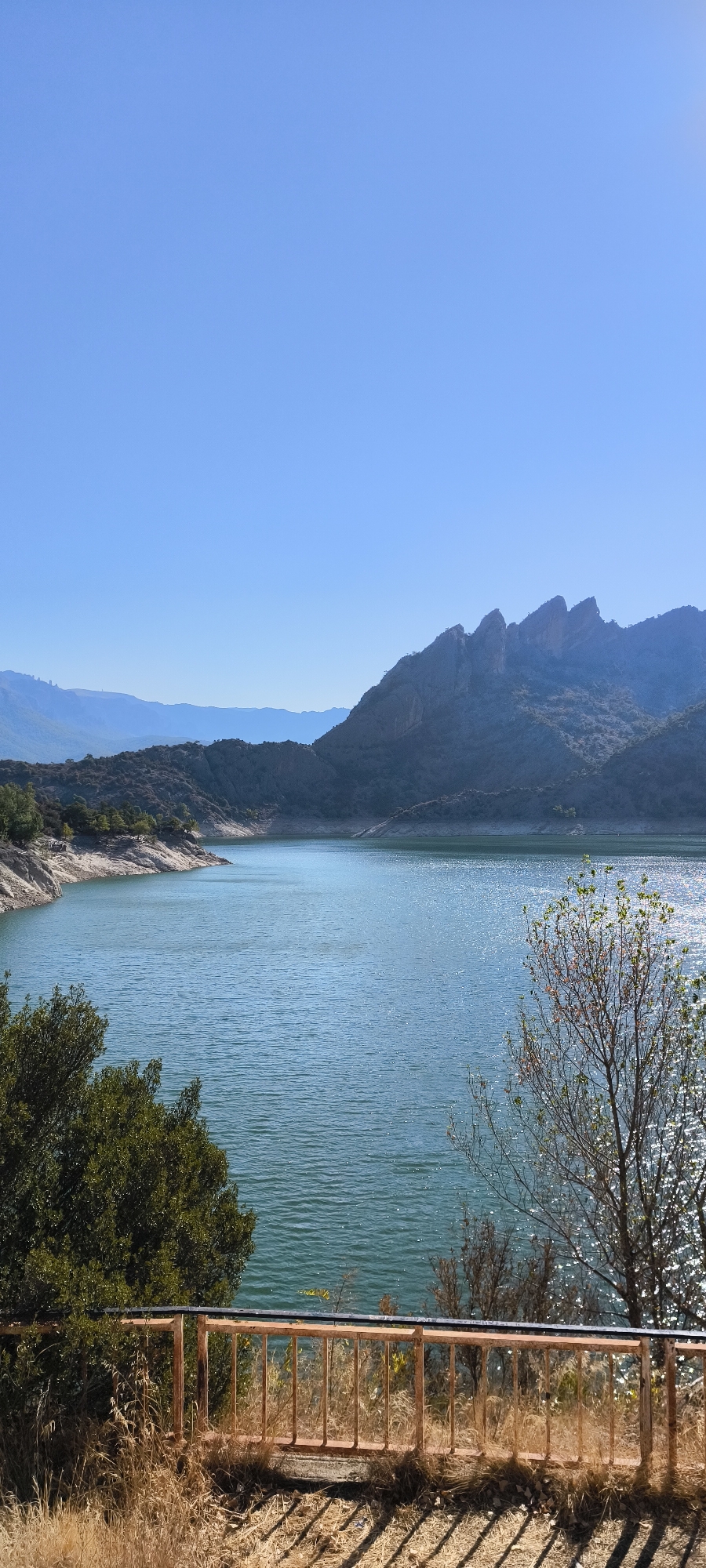 Peramola reservoir and dam on a clear August morning