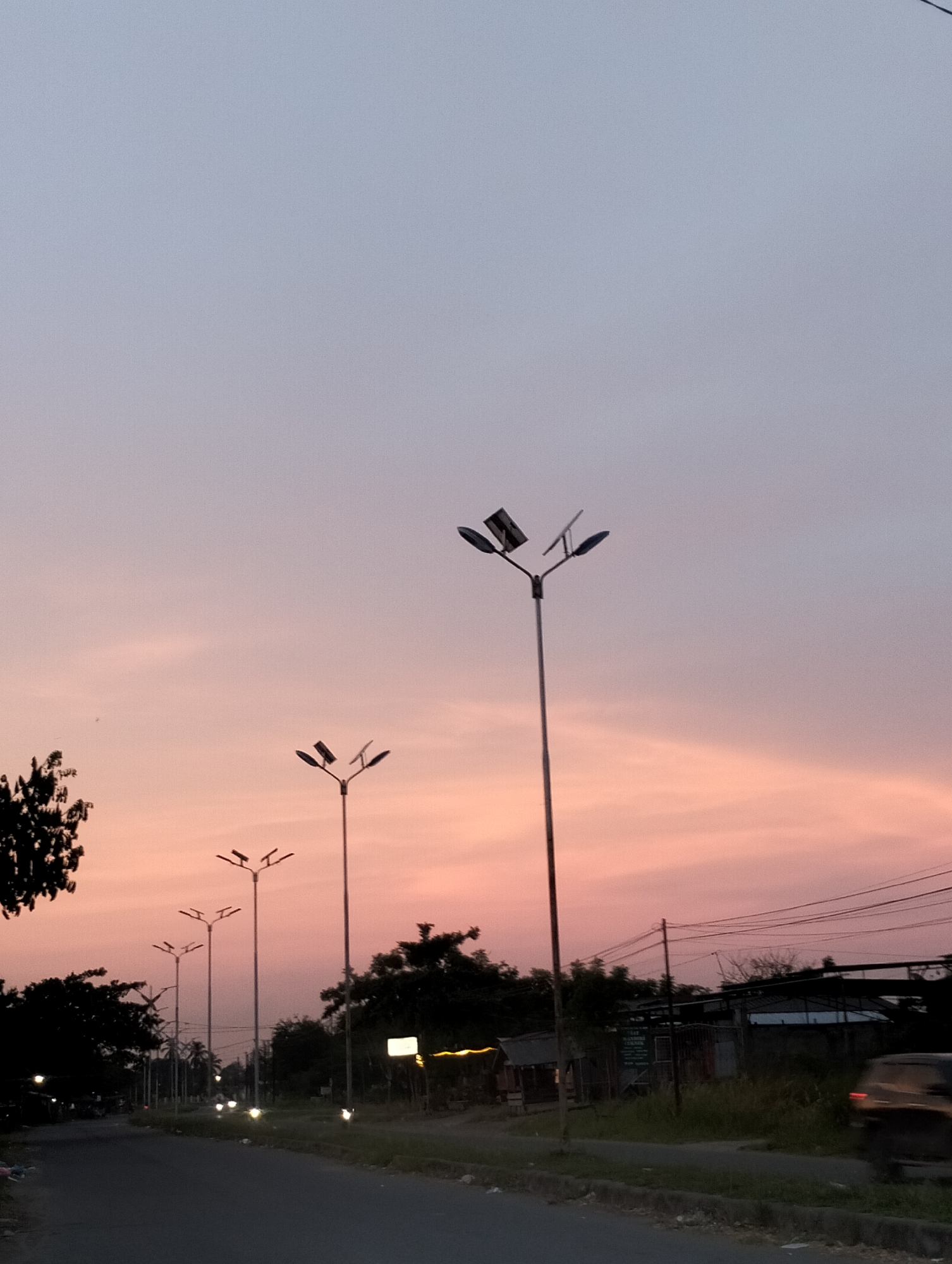 Sunset road scene photographed in Lhokseumawe, Indonesia