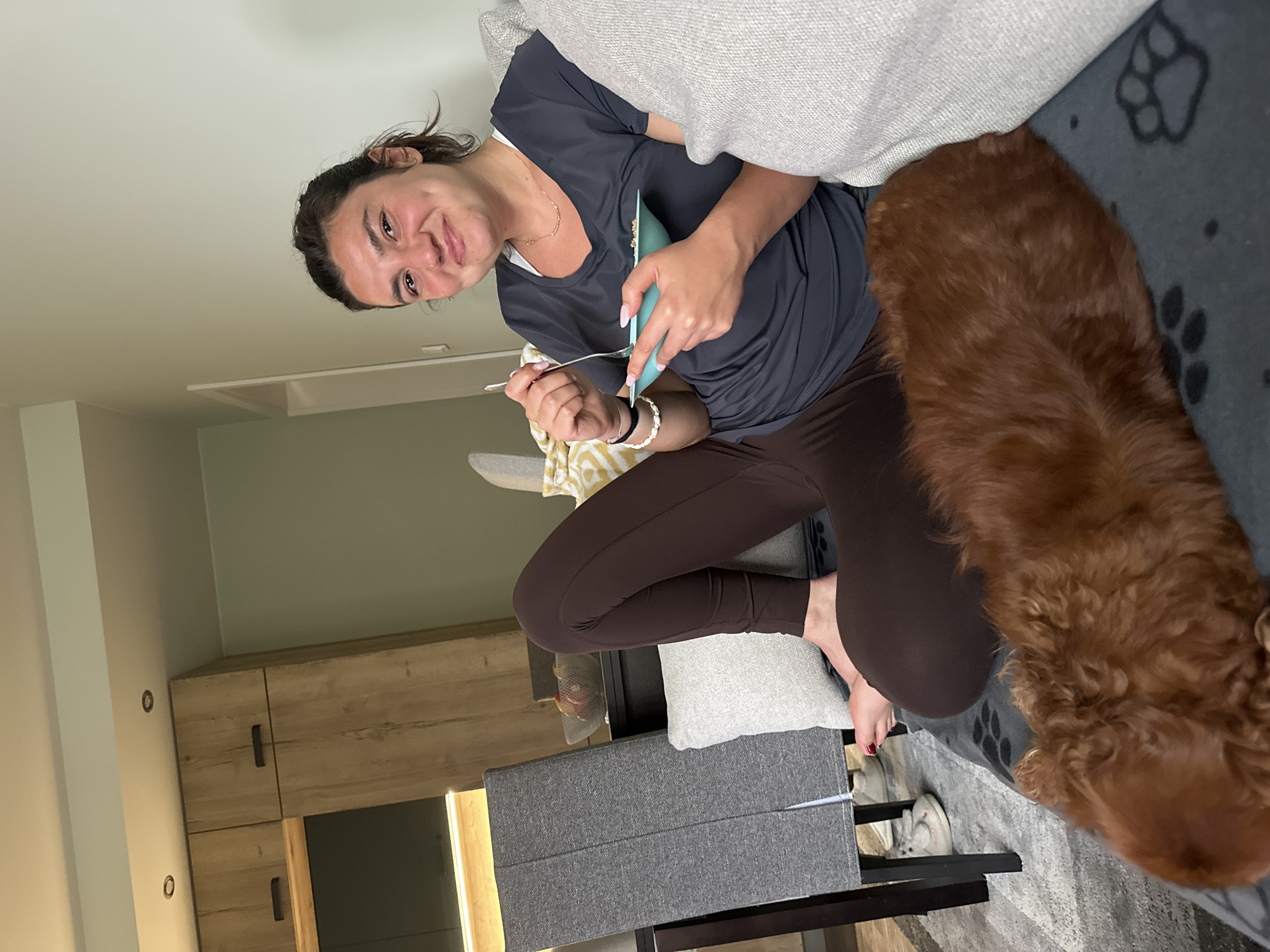 Woman and dog share quiet afternoon moment at Sofia home