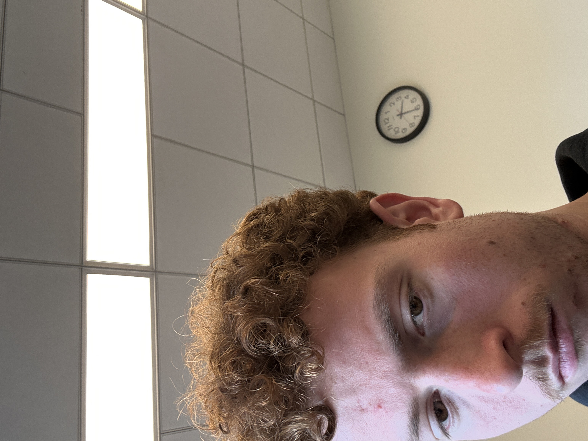 Student checks investment account during class in NYC