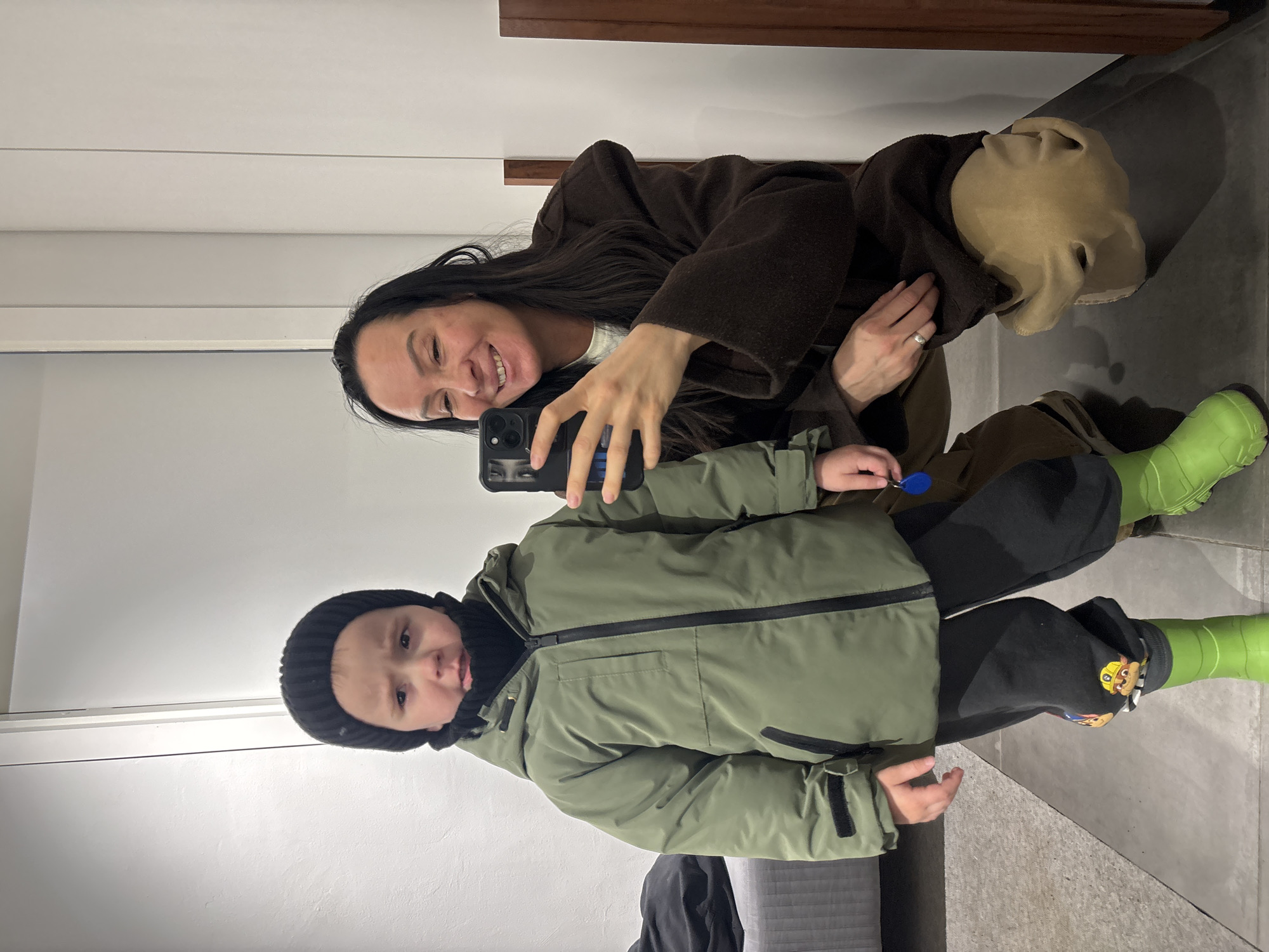 Woman and child take late-night selfies in Chaikovsky