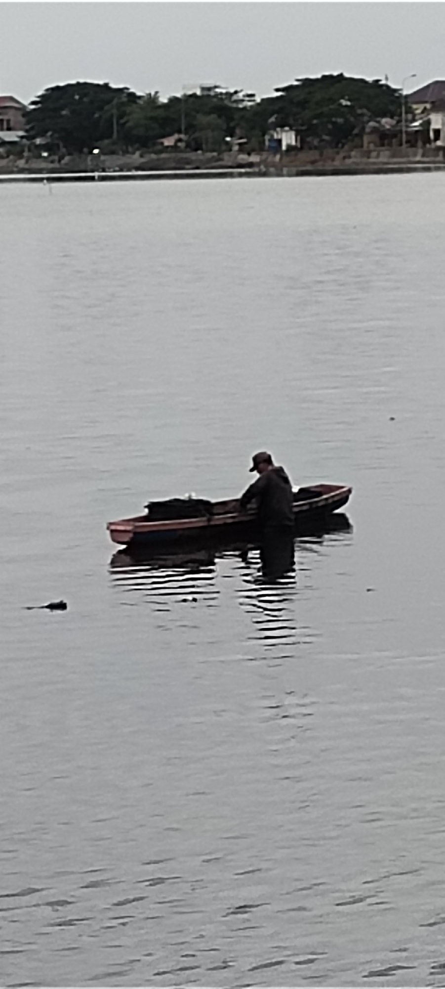 Morning activity on the waterways of Lhokseumawe, Indonesia