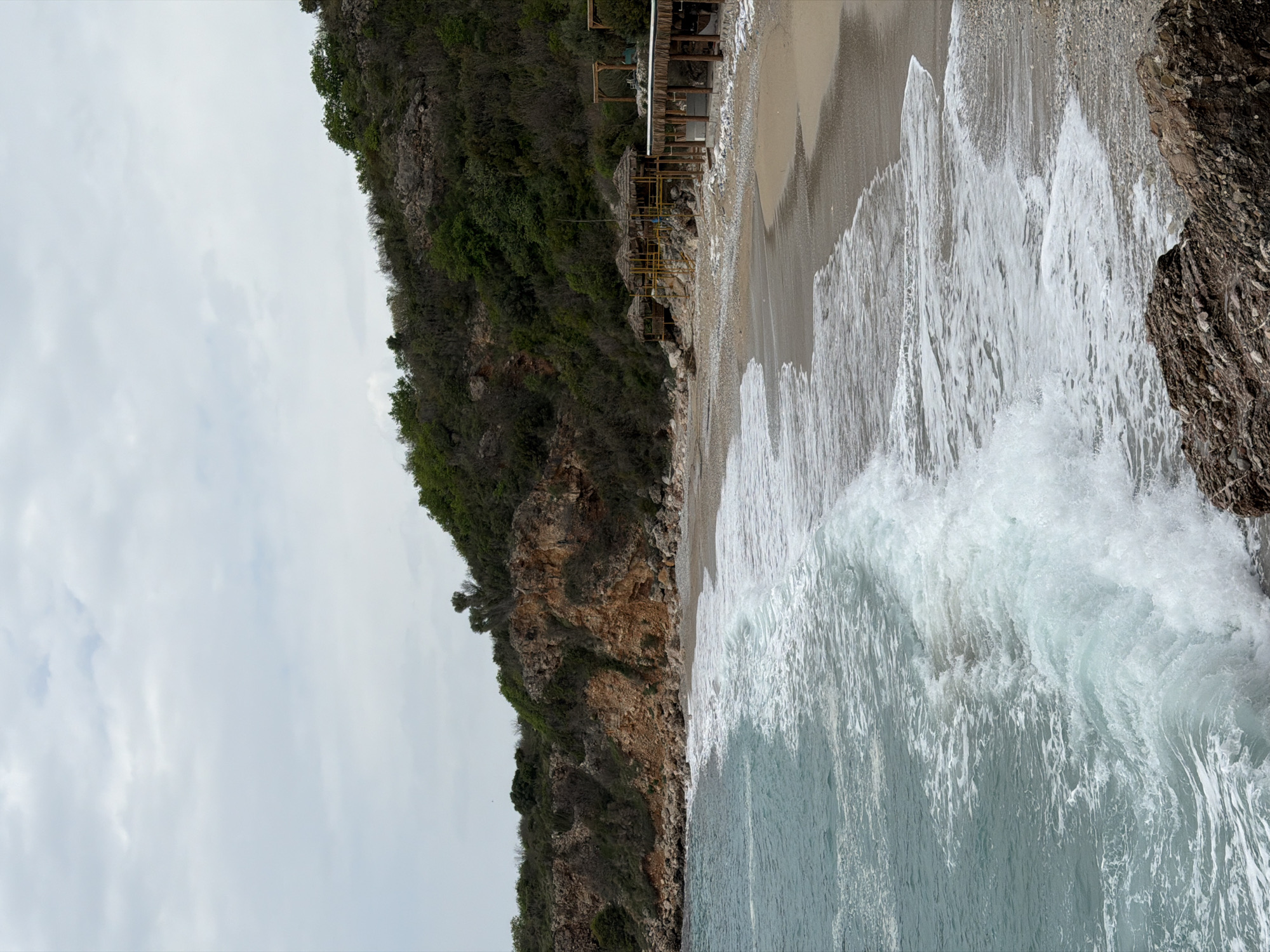 Woman visits scenic Drobnići beach with dog in Montenegro