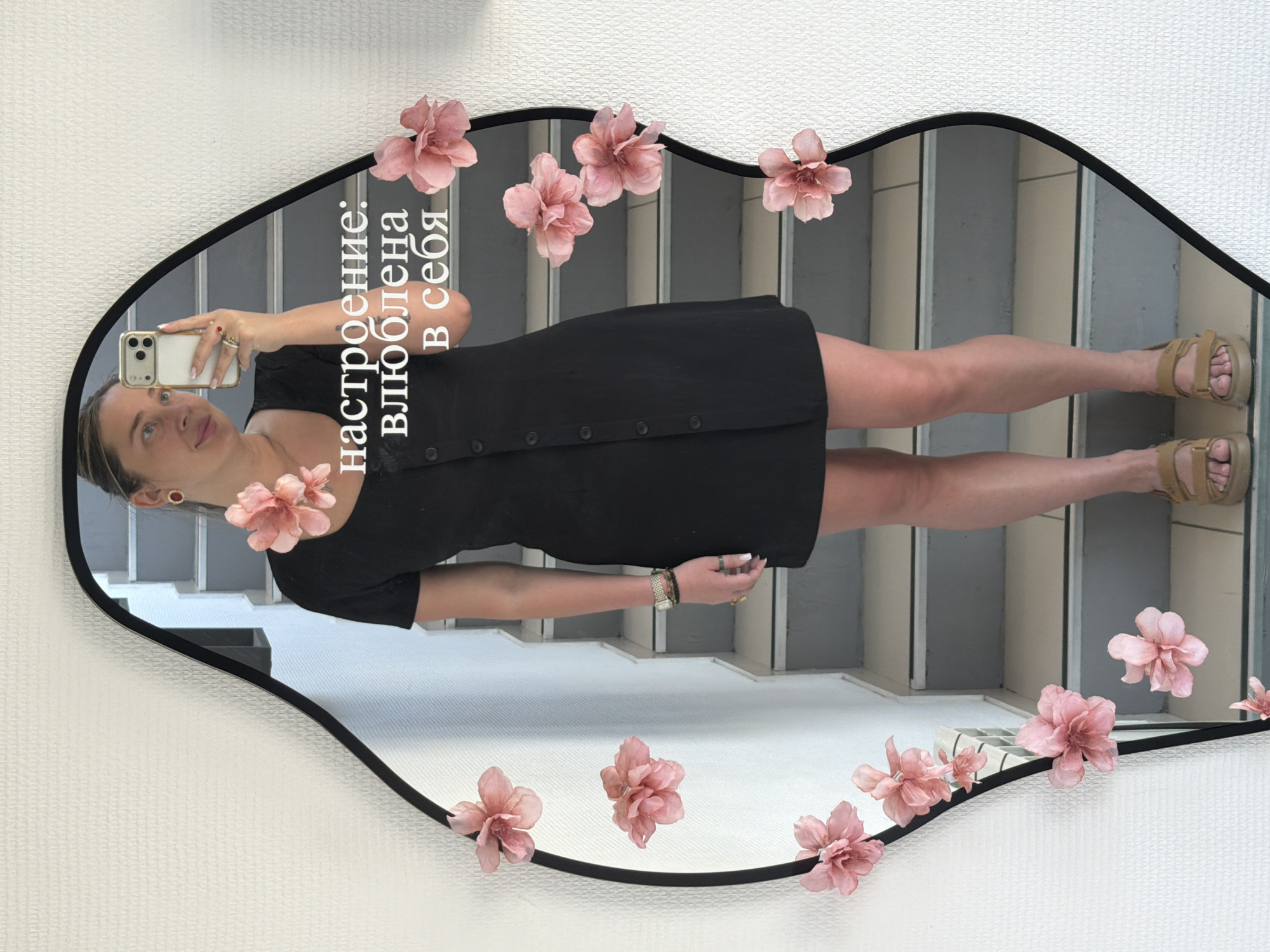 Woman takes selfies in decorative mirror in Chaikovsky