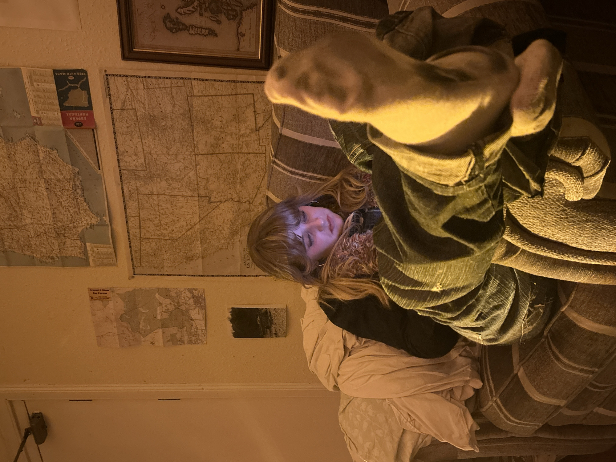 Person relaxing at home during nighttime hours in Dundee