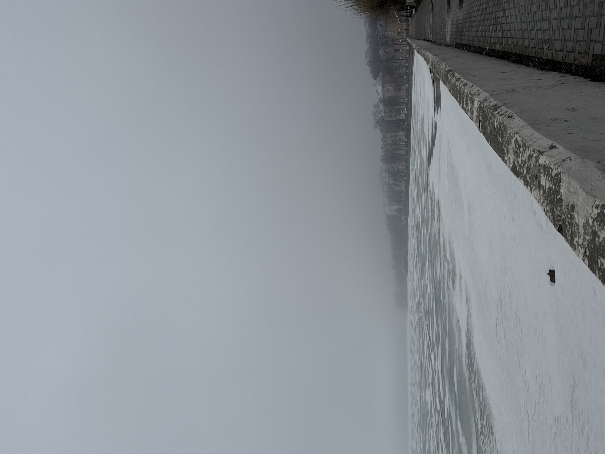 Foggy spring conditions observed along frozen river in Votkinsk
