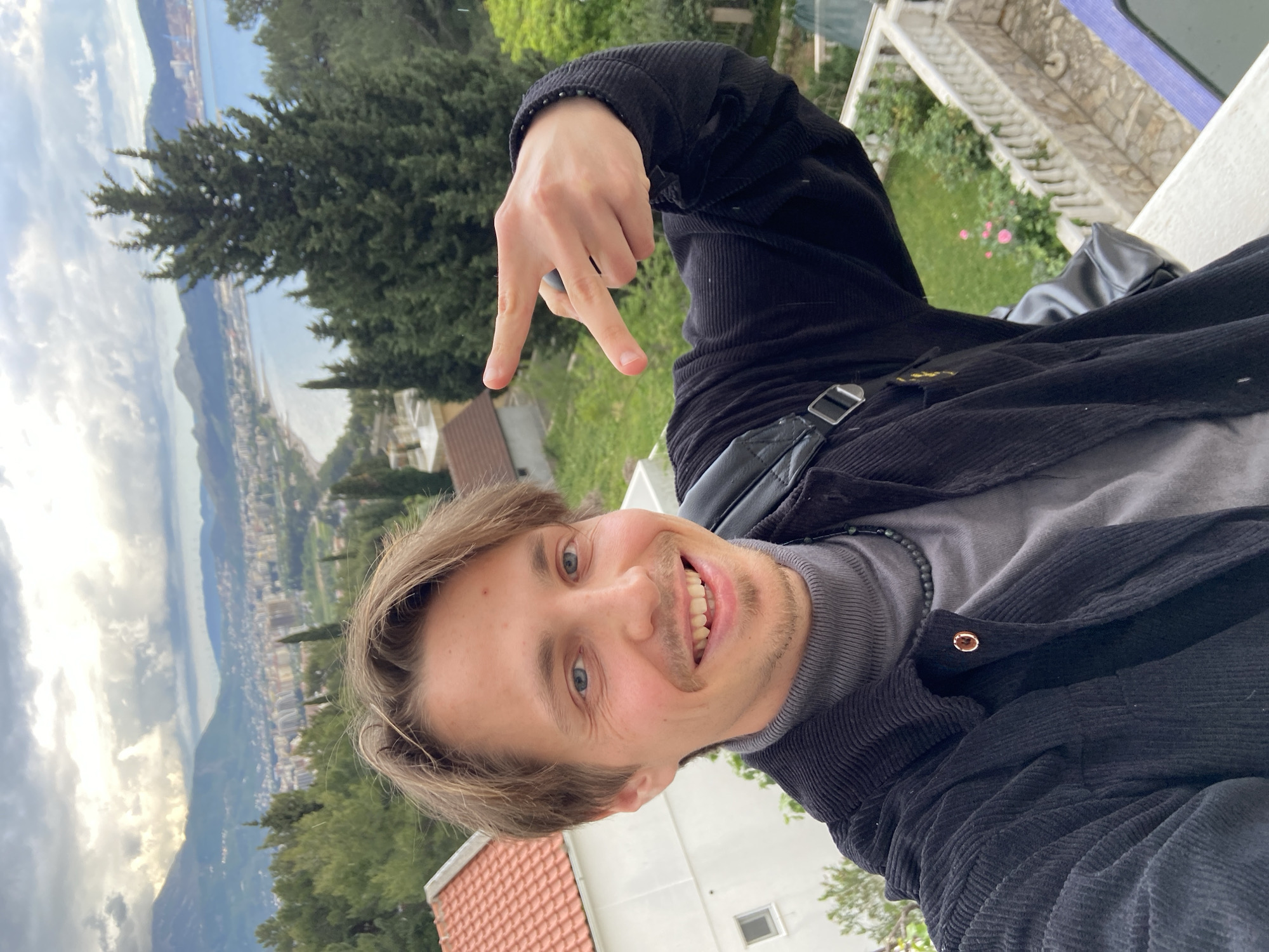 Tourist captures selfie and coastal views in Šušanj, Montenegro