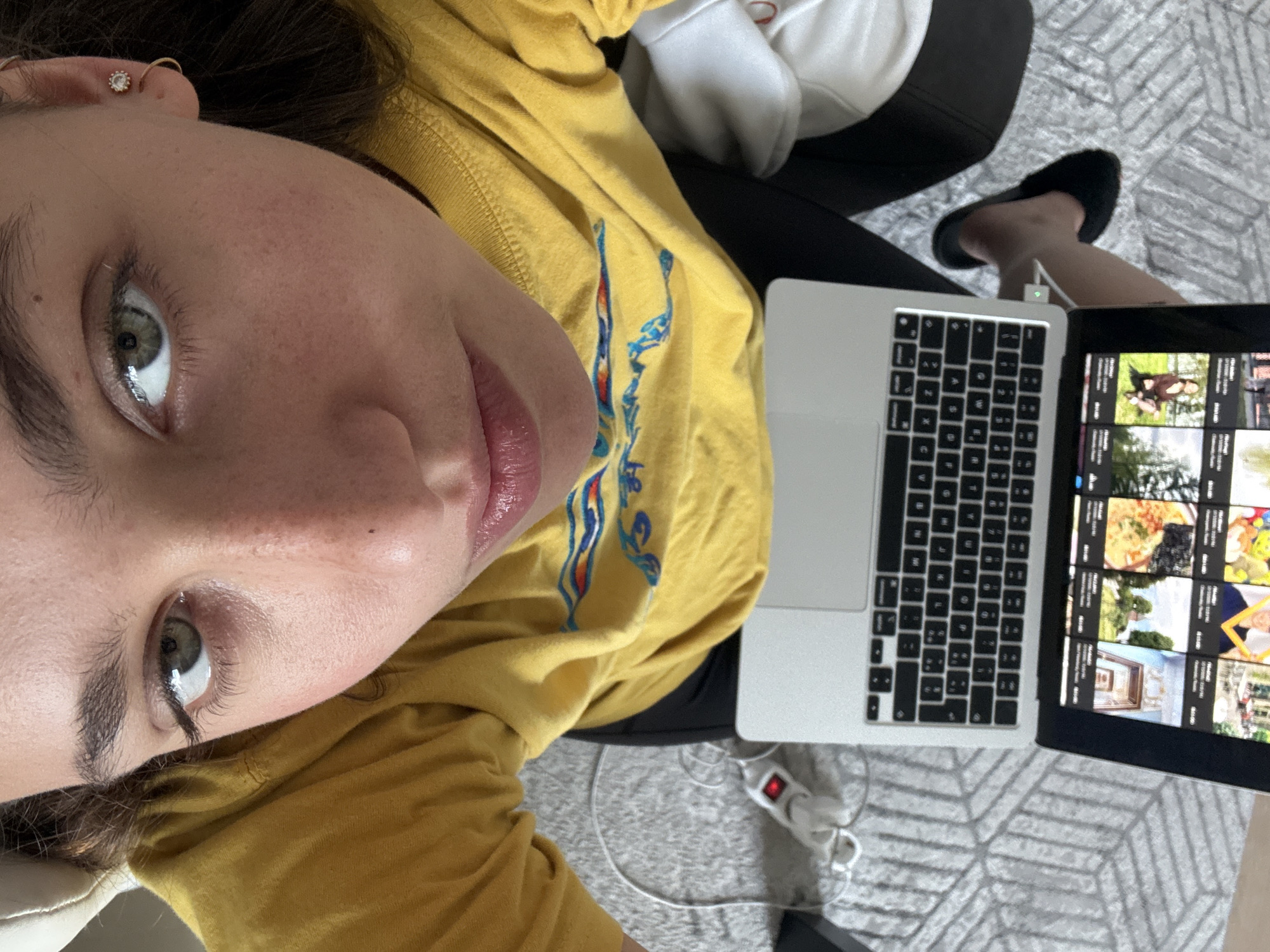 Person takes couch selfie in Milan apartment