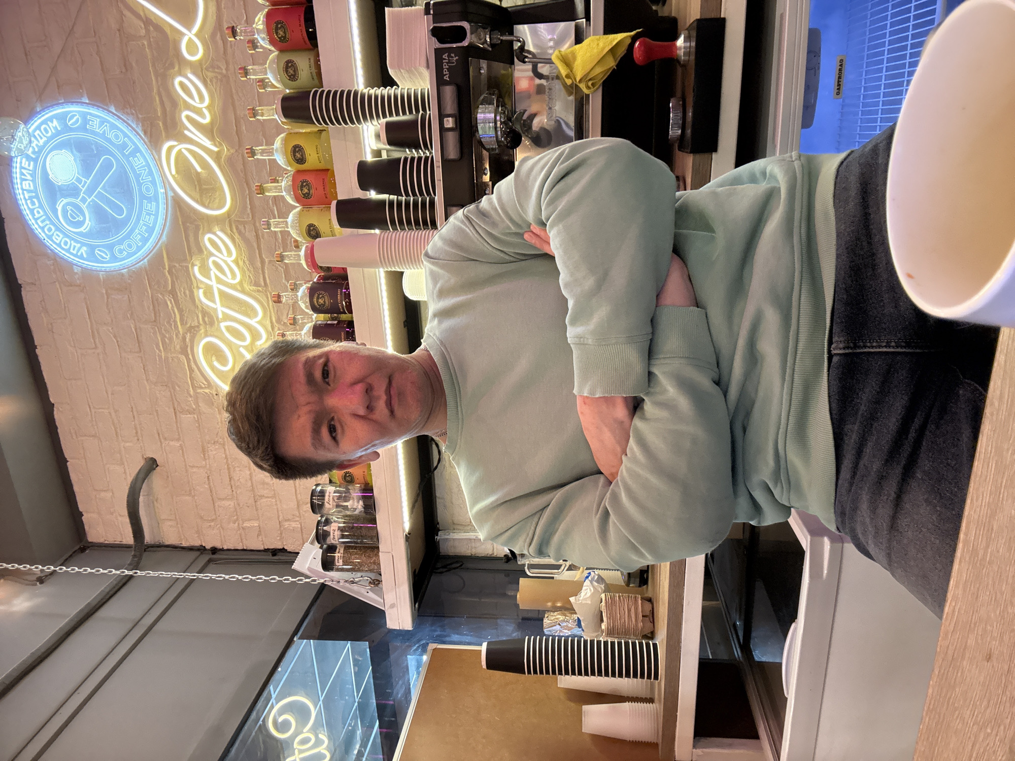 Customer waits at coffee shop counter in Dolgoprudny