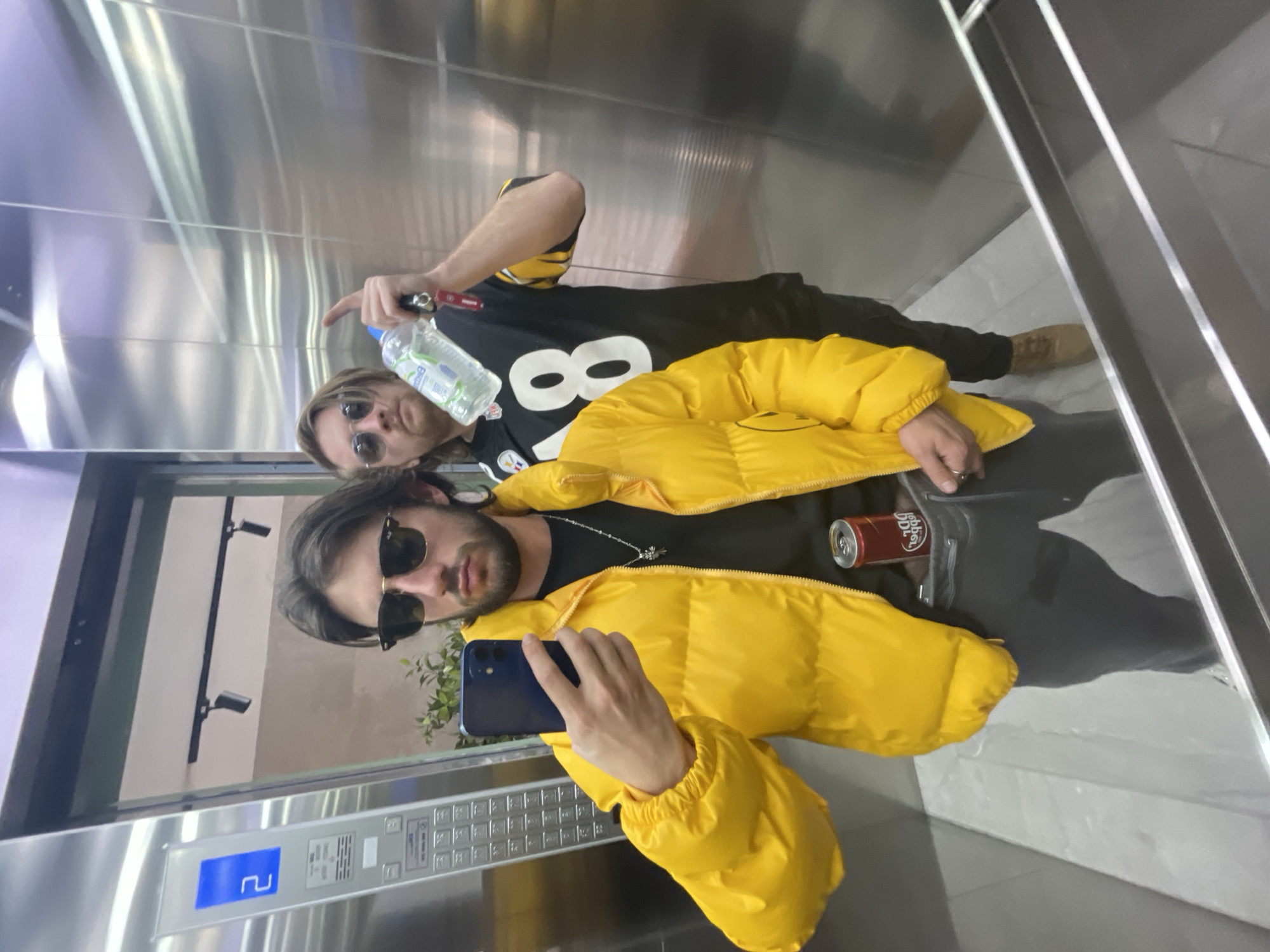 Two men take selfies in Mexico City area buildings