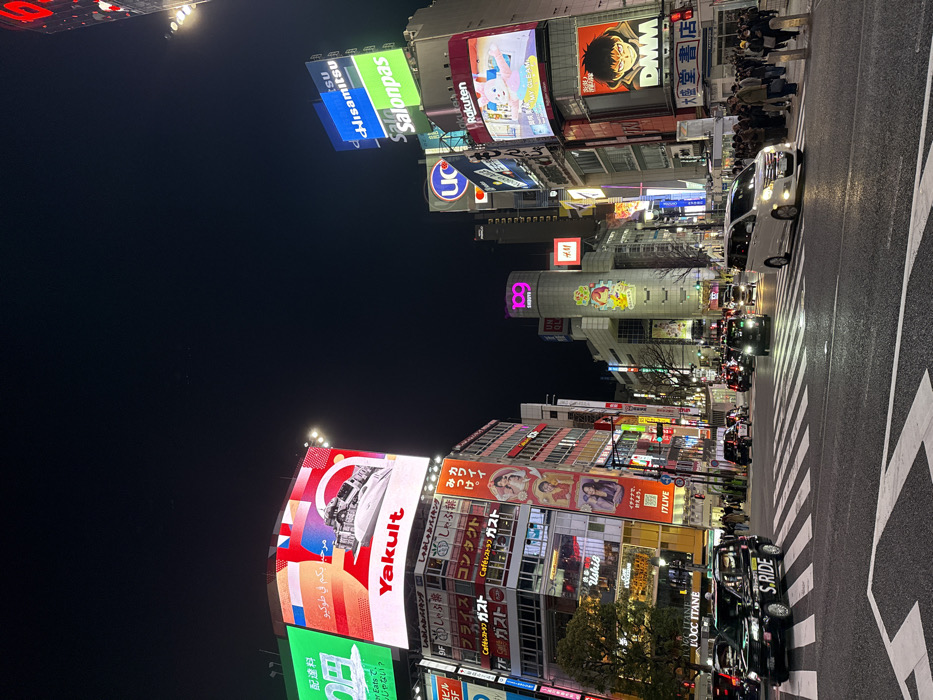 Night scene documented at Tokyo's busy Shibuya intersection
