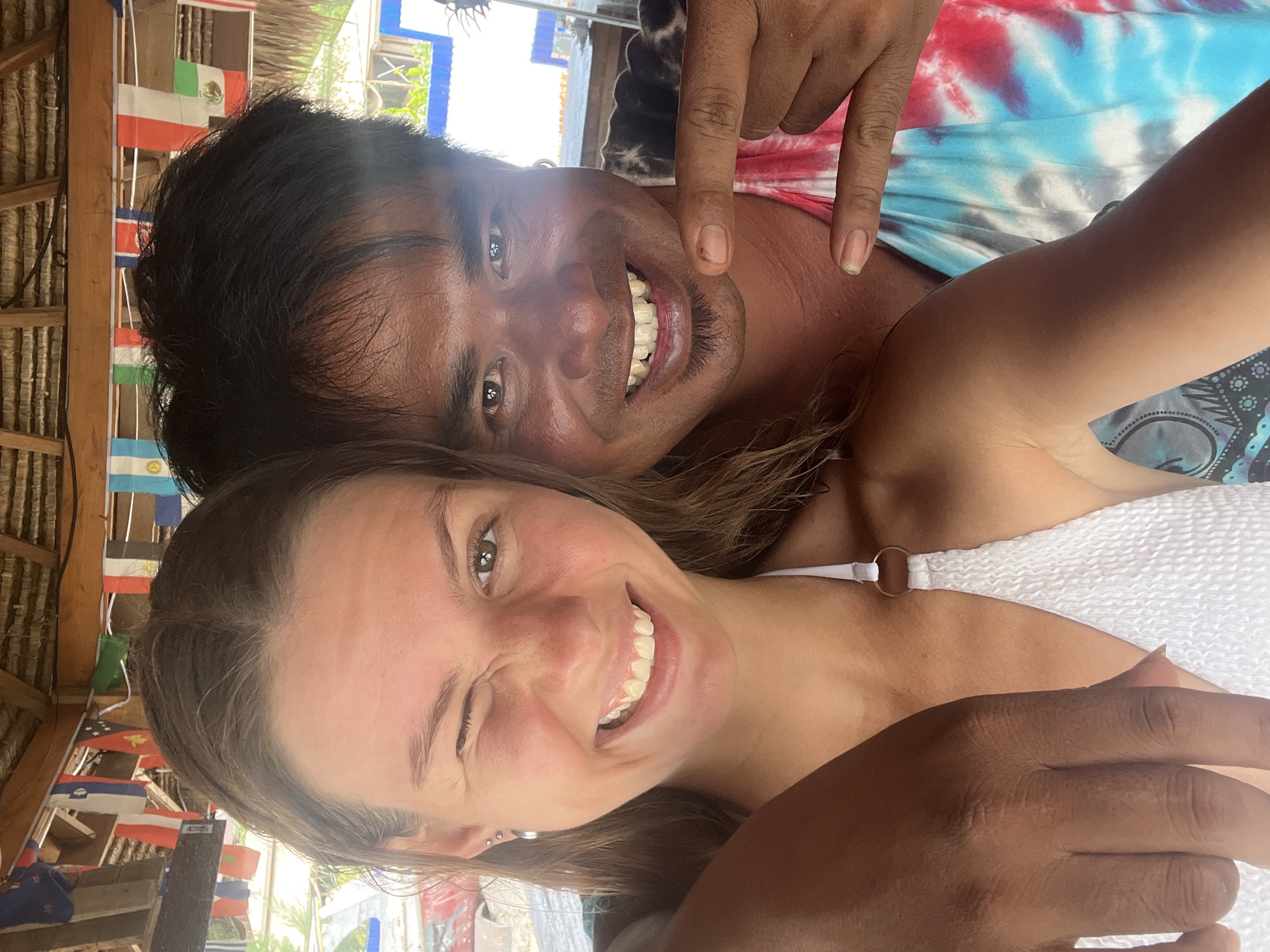 Tourists take selfies at flag-decorated Indonesian shelter