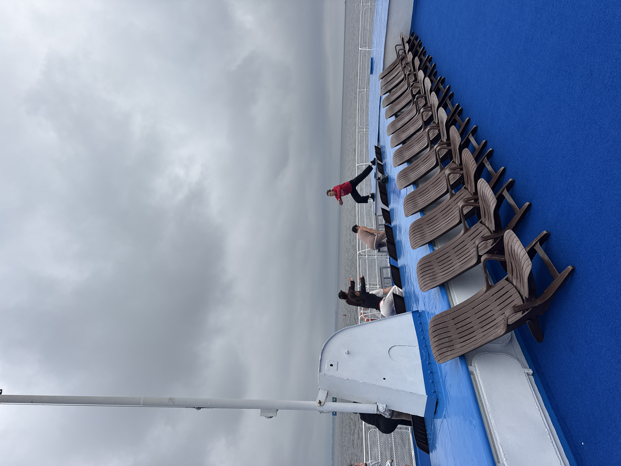 Workout session on a Russian ferry deck under cloudy skies