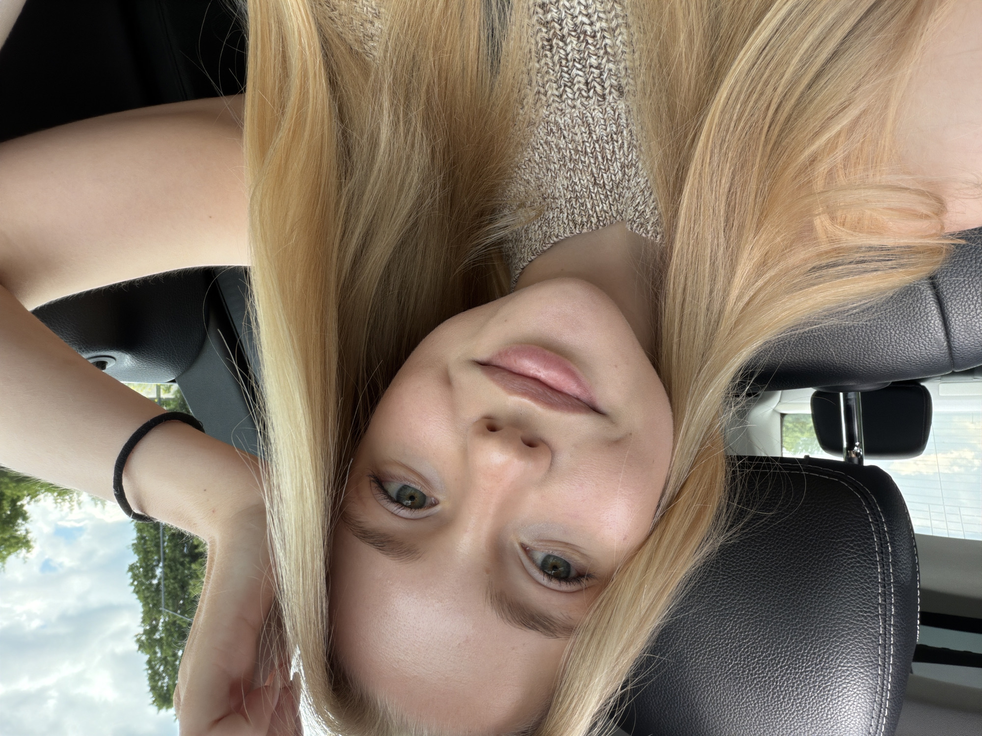 Woman takes selfie while driving vehicle Sunday morning