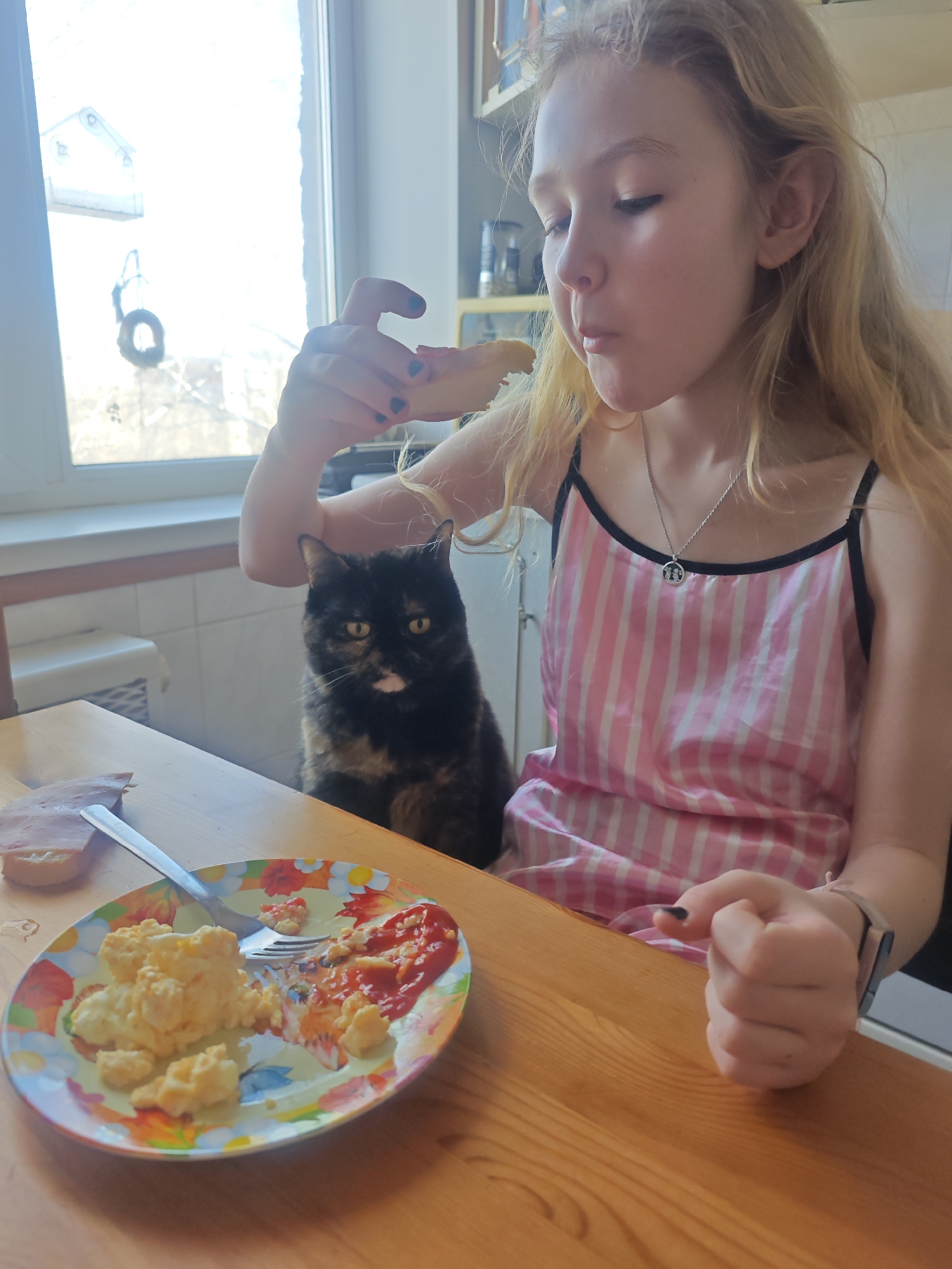 Young girl dining at table in Samara, Russia