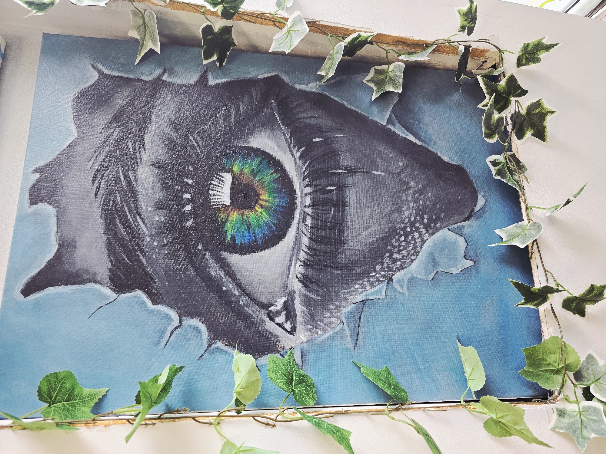 Framed eye painting with rainbow iris observed in Bulgaria