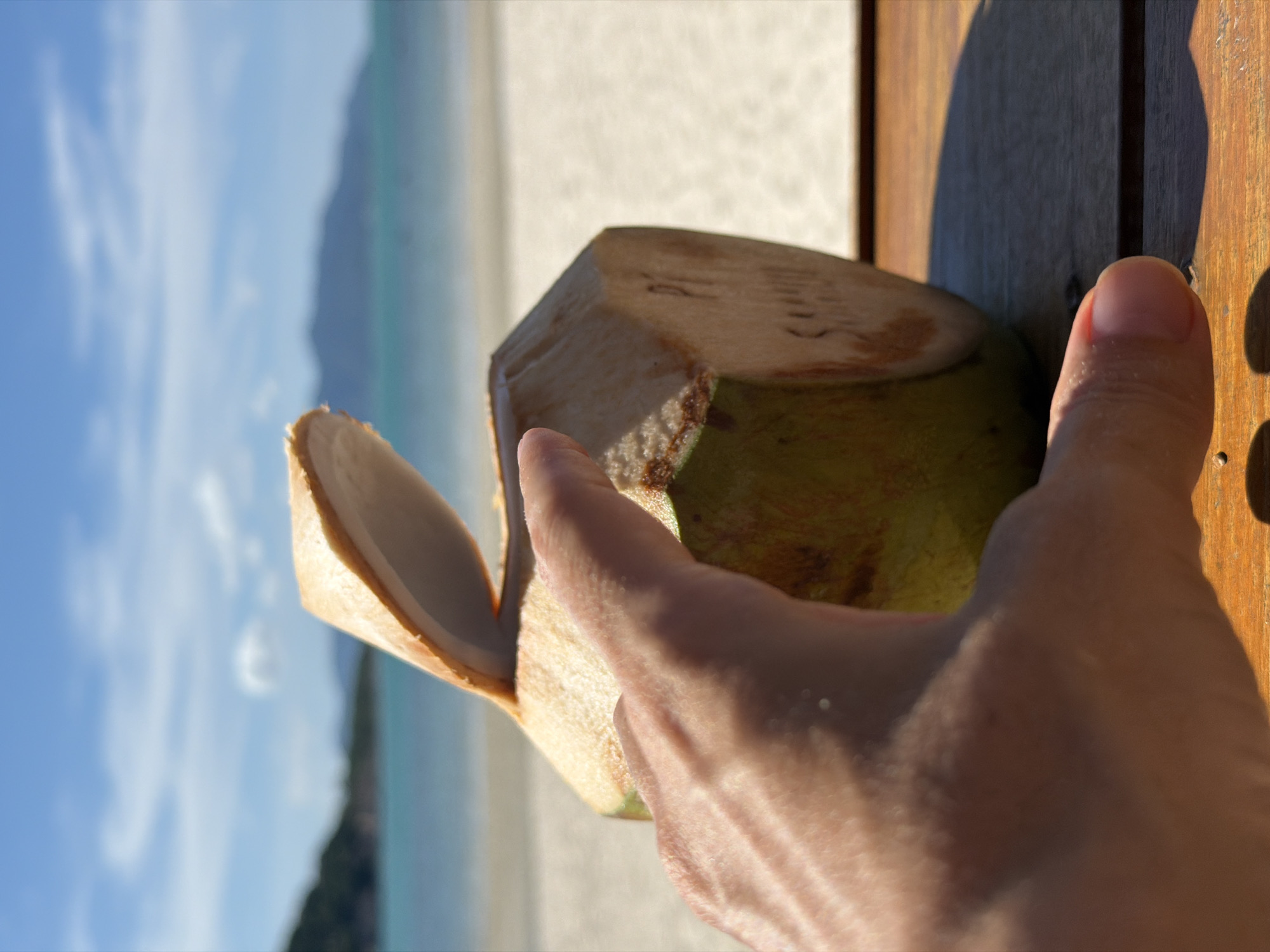 Fresh coconut cracked open beachside in Baan Plai Laem