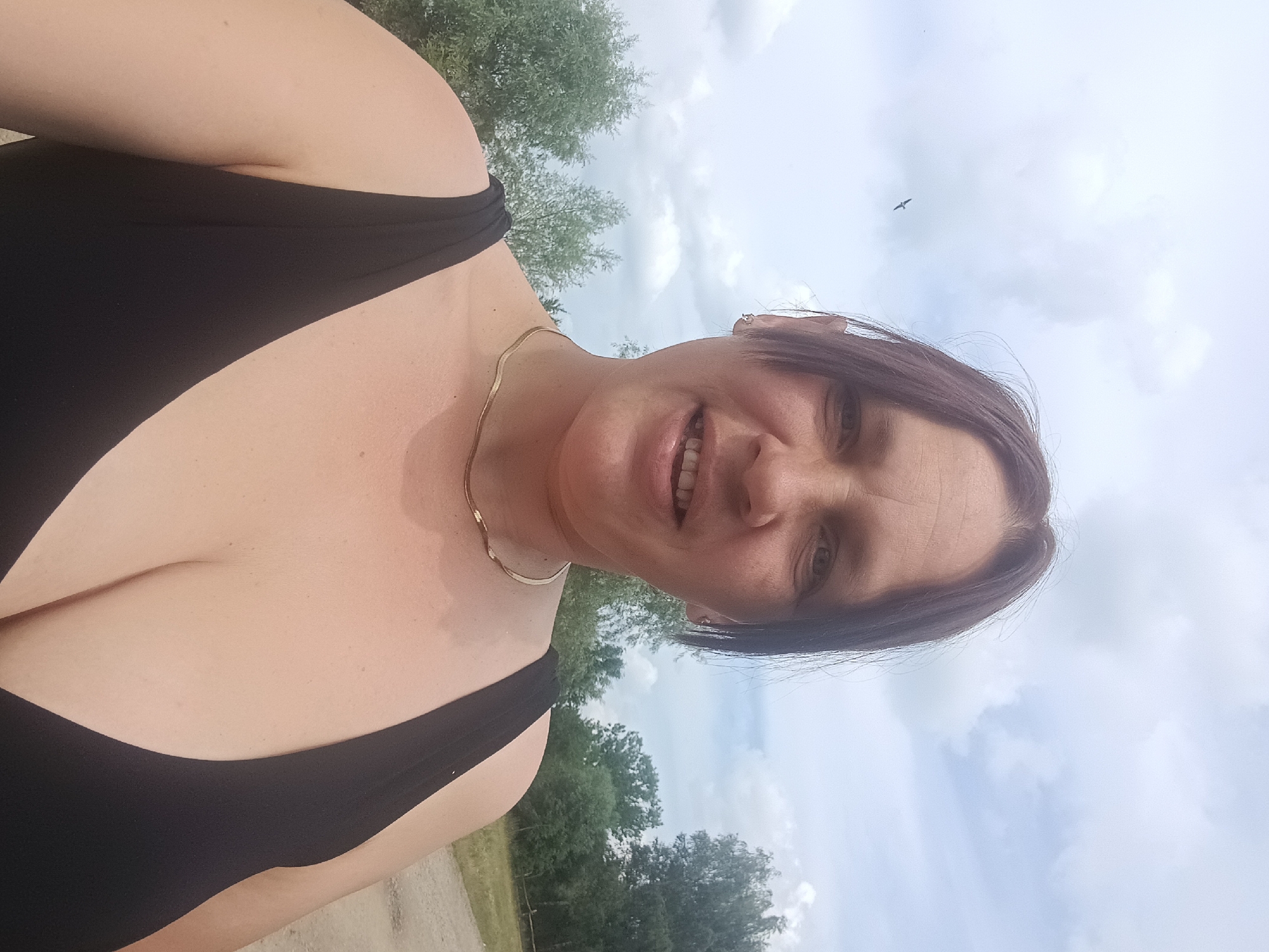 Swans at a pond and a selfie on a cloudy day in Litynia