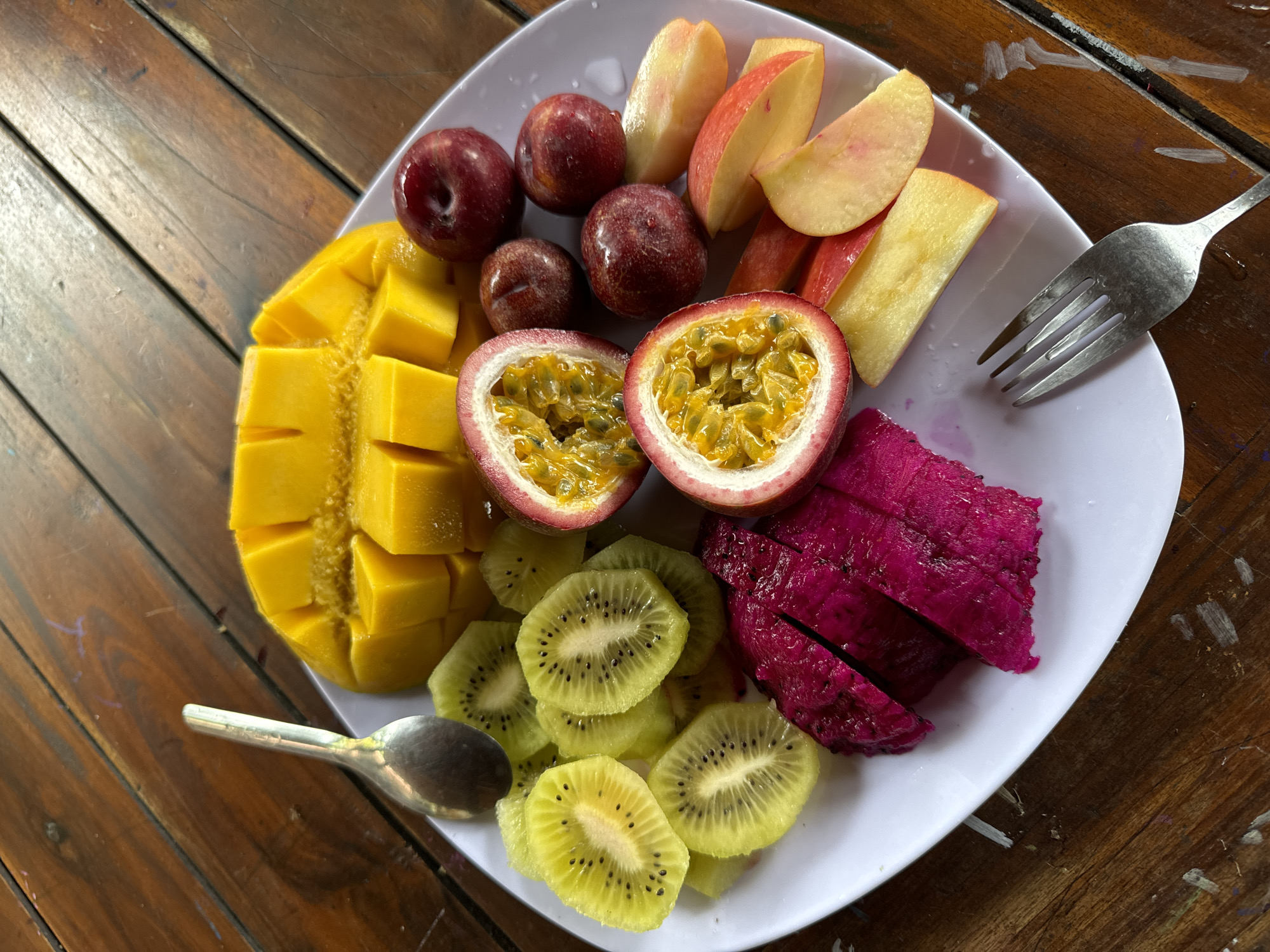 Family enjoys tropical fruit breakfast in Mũi Né, Vietnam