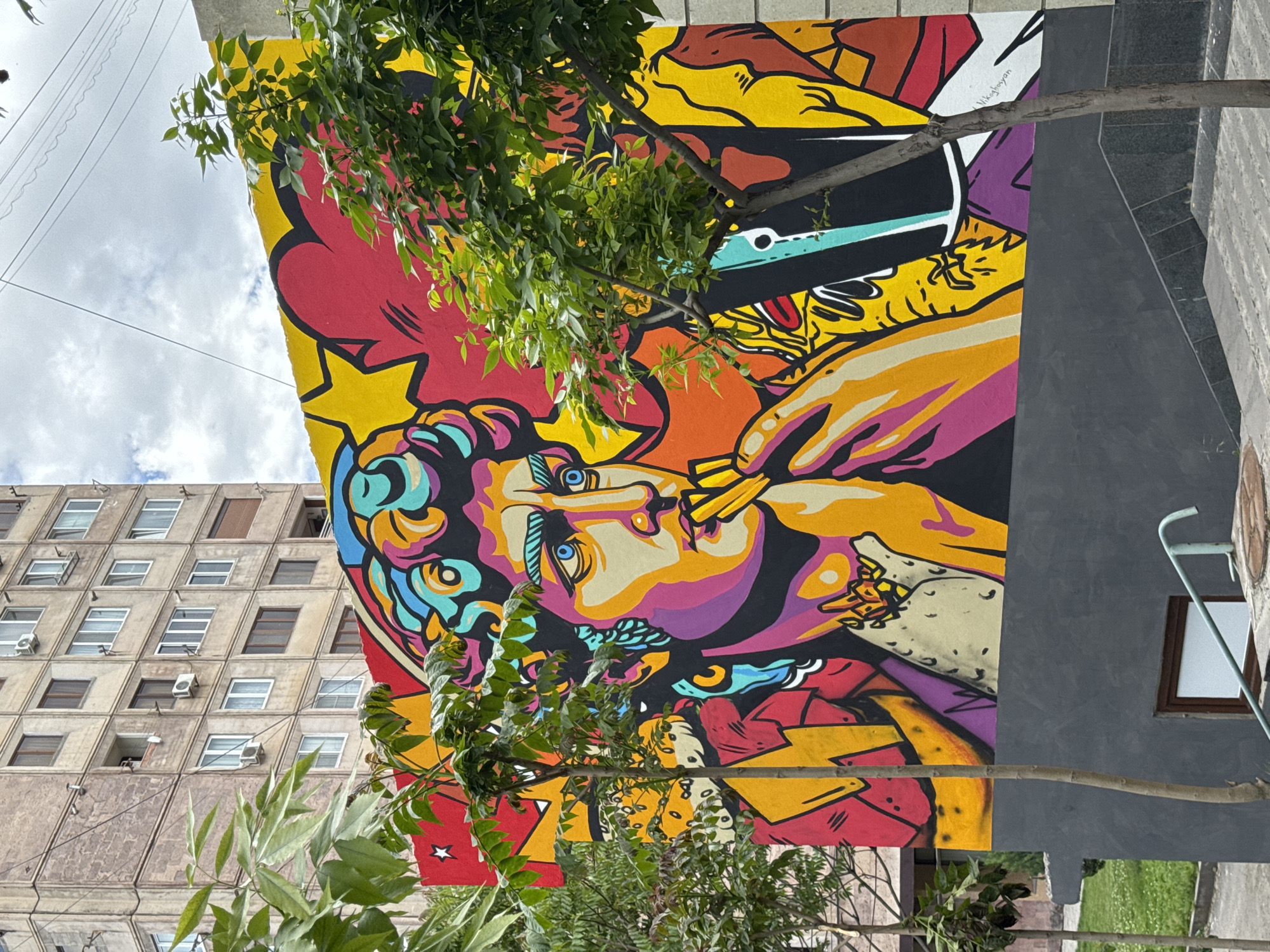 Vibrant smoking portrait mural spotted on Yerevan building