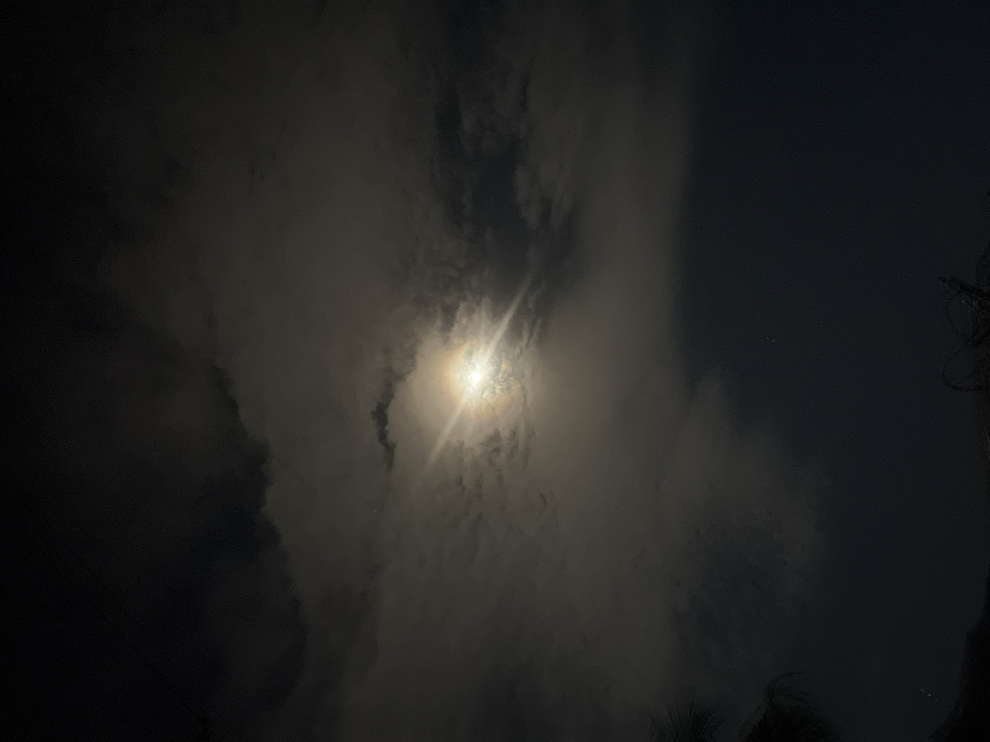 Moon through the clouds over Kubwa, Nigeria